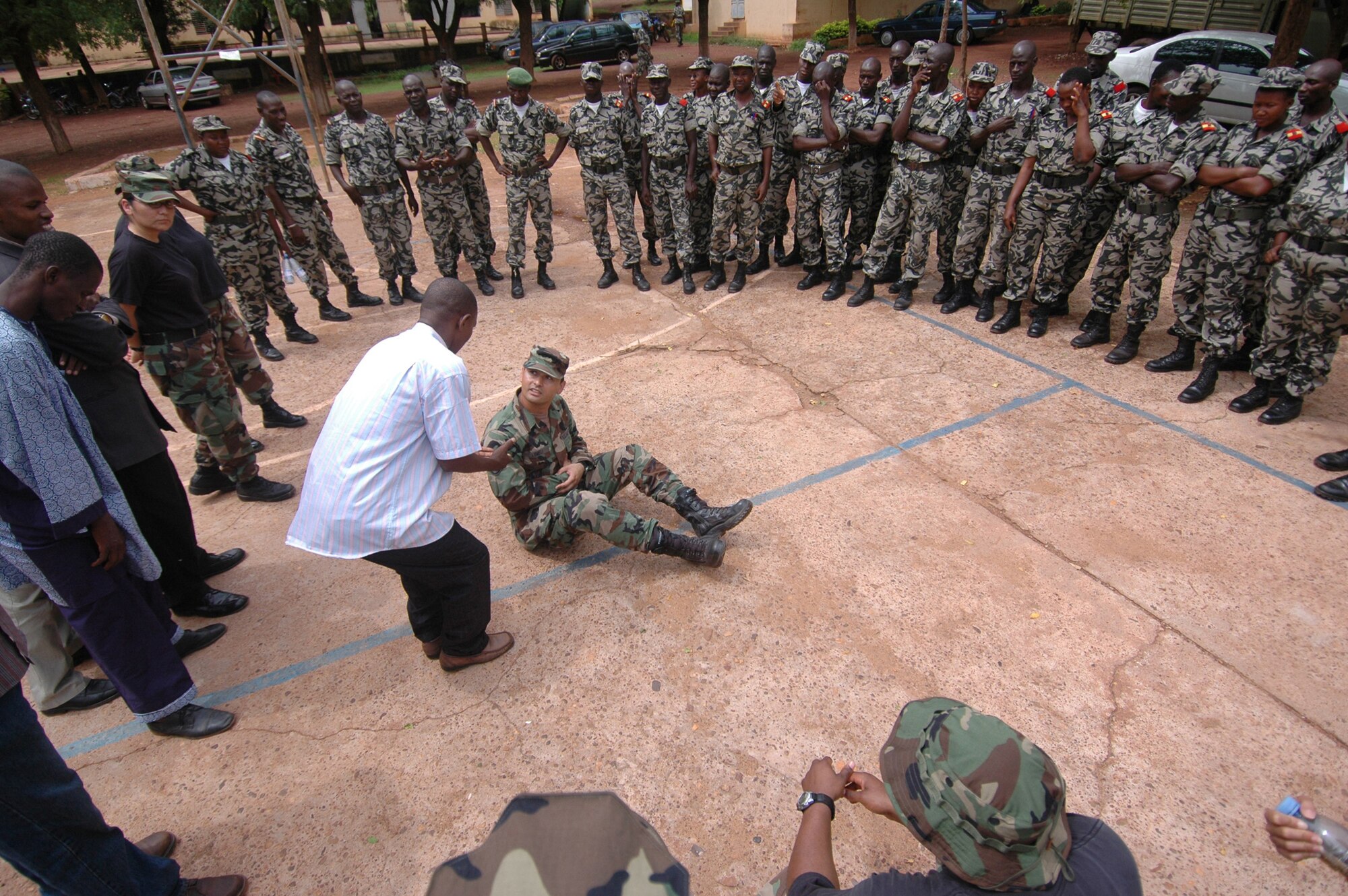 BAMAKO, Mali -- Staff Sgt. Carlos Lomeli simulates an injury for Malian medics and nurses to learn how to properly triage patients July 15, 2008, during MEDFLAG 08. Malian medics and nurses received their first-ever mass casualty training in Kati, Mali, 15 kilometers outside the capital city of Bamako. Sergeant Lomeli is assigned to the 48th Medical Group, Royal Air Force Lakenheath, England. (U.S. Air Force photo/Senior Airman Justin Weaver)