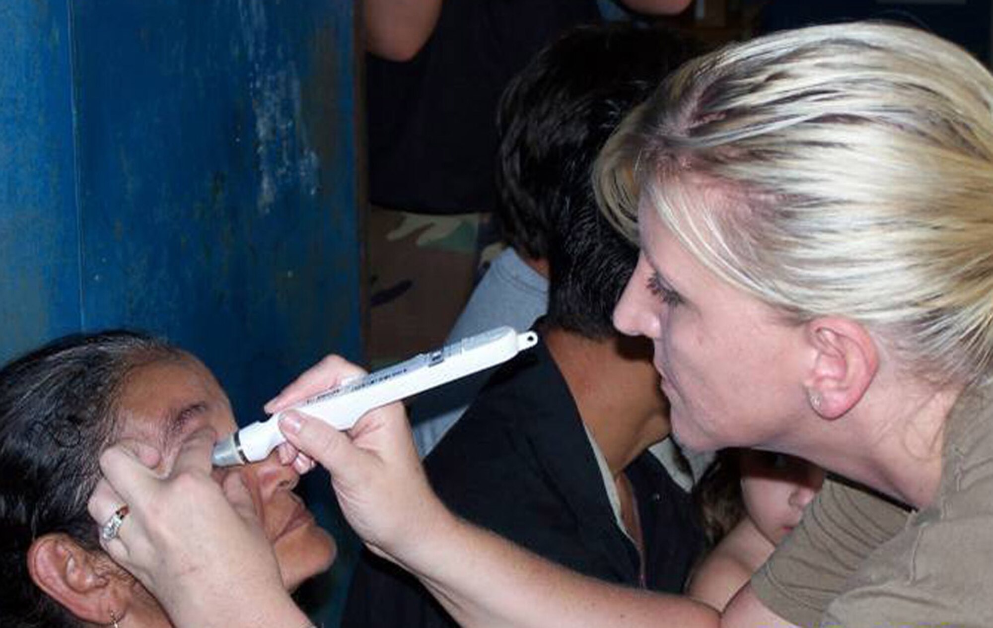 Tech. Sgt. Kellie Remmert performs a tenometry exam on a patient during a medical readiness exercise, or 'MEDRETE' mission June 23 in Poto Si, El Salvador. Airmen from the 21st Medical Group are supporting the Central American exercise as part of an ongoing U.S. Southern Command initiative. (U.S. Air Force photo)
