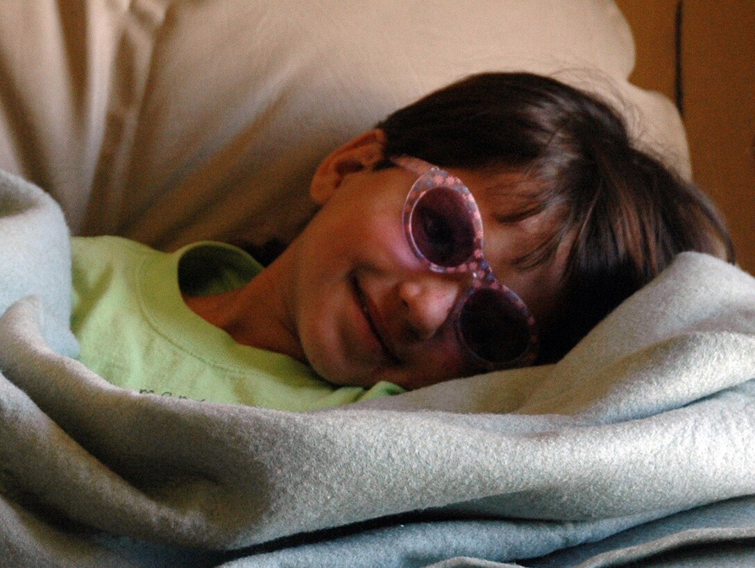 Gulzana Haqim rests in her quarters after being released from the hospital following a successful surgery at Bagram Air Field, Afghanistan on July 11. The 6-year-old girl was treated by Coalition doctors at the Craig Joint Theater Hospital on Bagram. (U.S. Army photo/Sgt. Daniel Love)  