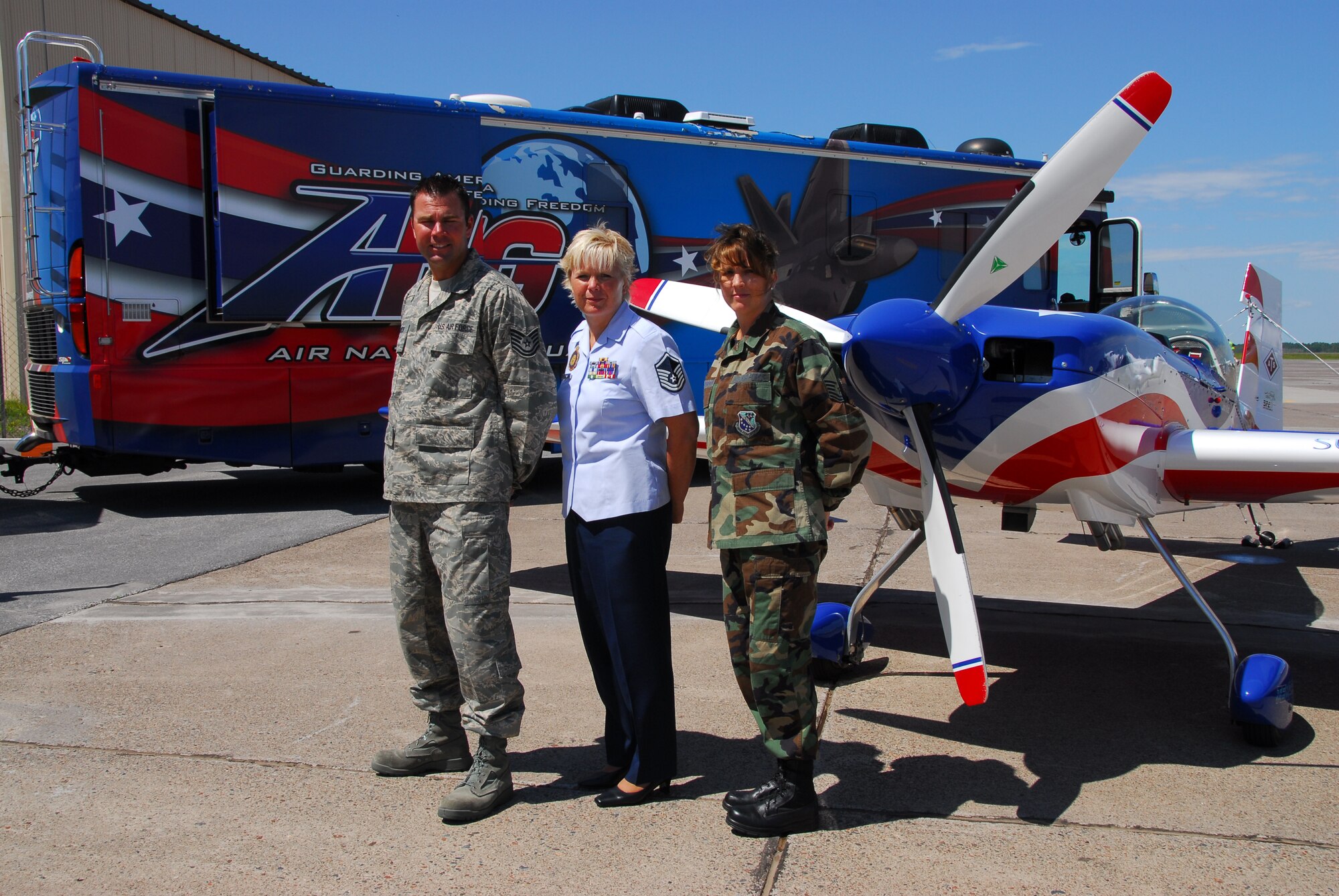 U.S. Air National Guard recruiters from the 148th Fighter Wing pose in front of the ANG mobile recruiting unit and a Staudacher S300 before an air show in Duluth, Minn. on 14 July, 2008.  John Klatt and the Guarding America, Defending Freedom Aerobatic team will be performing at the Duluth Air Show to promote the Air National Guard 19-20 July, 2008 . (U.S. Air Force photo by Tech. Sgt. Jason W. Rolfe)  (Released) 