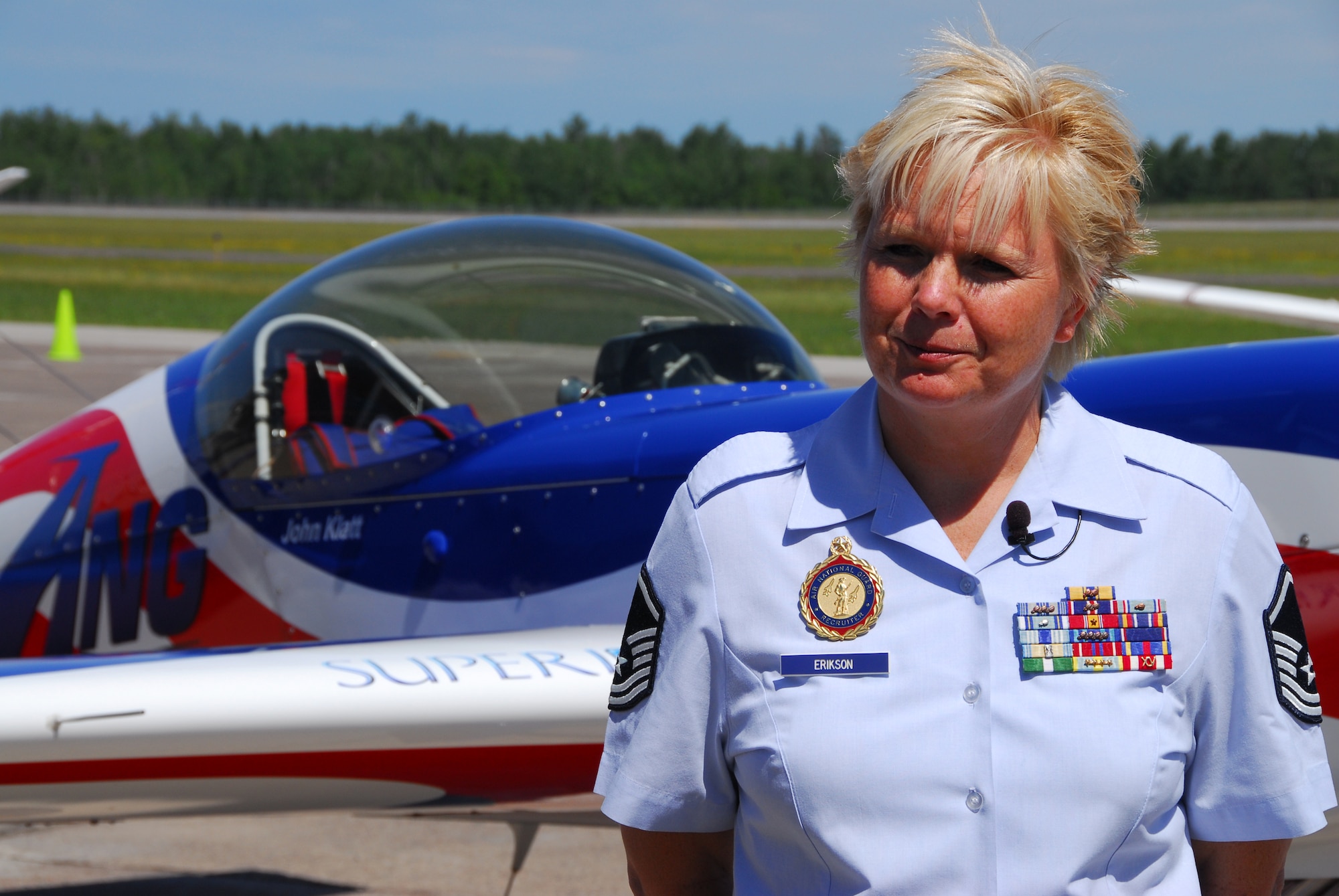 U.S. Air Force Master Sgt. Lisa Erikson, 148th Fighter Wing recruiter, talks with a local reporter about the ANG aerobatic demonstration team in Duluth, Minn. on 14 July, 2008.  John Klatt and the Guarding America, Defending Freedom Aerobatic team will be performing at the Duluth Air Show to promote the Air National Guard 19-20 July, 2008 . (U.S. Air Force photo by Tech. Sgt. Jason W. Rolfe)  (Released) 