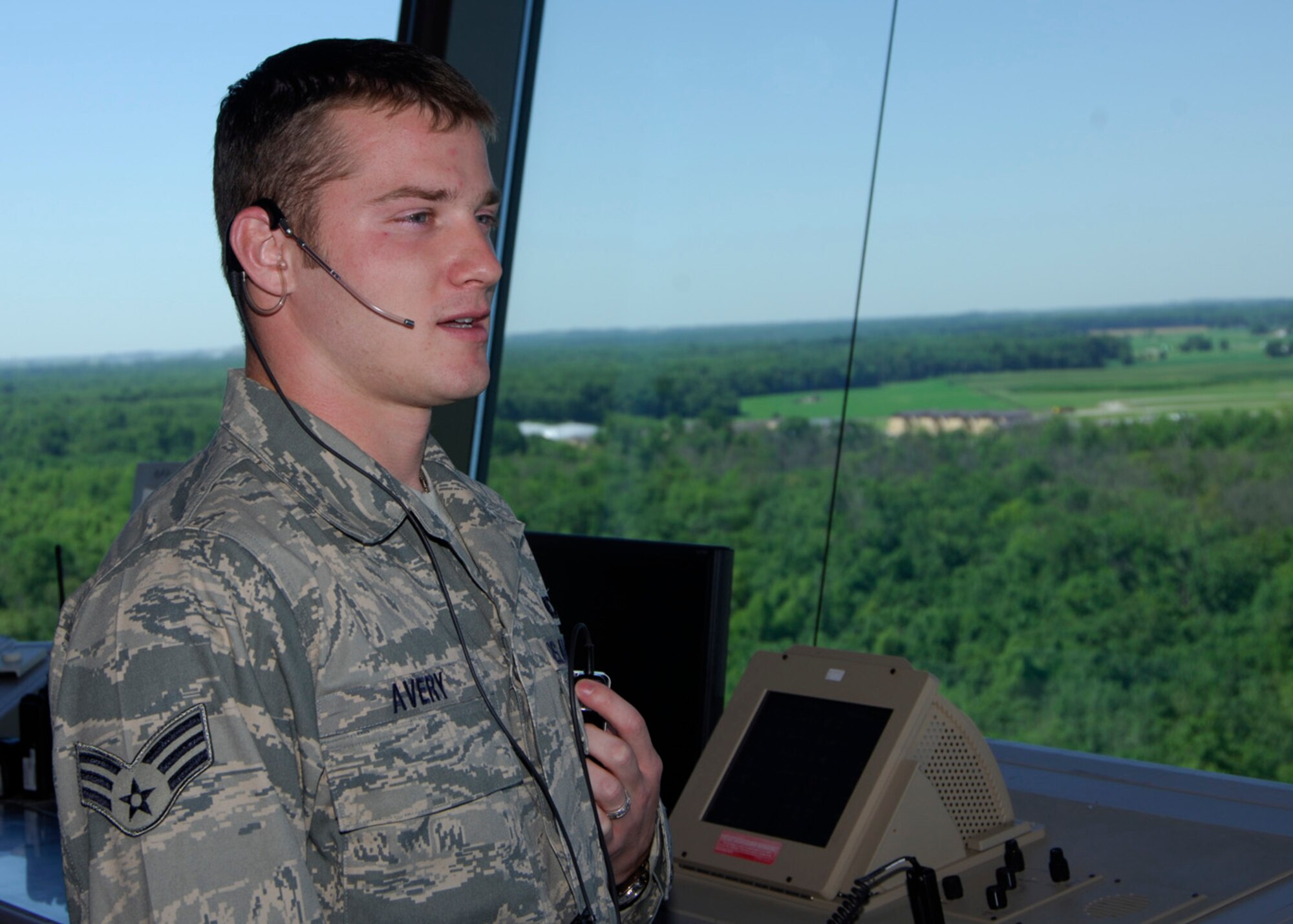SCOTT AIR FORCE BASE, Ill. --Senior Airman Avery, 375th Operations Support Squadron air traffic control journeyman, demonstrates how to observe planes and make sure they are clear for landing at Scott’s air traffic control tower. 
(US Air Force photo/Airman 1st Class Wesley Farnsworth)
