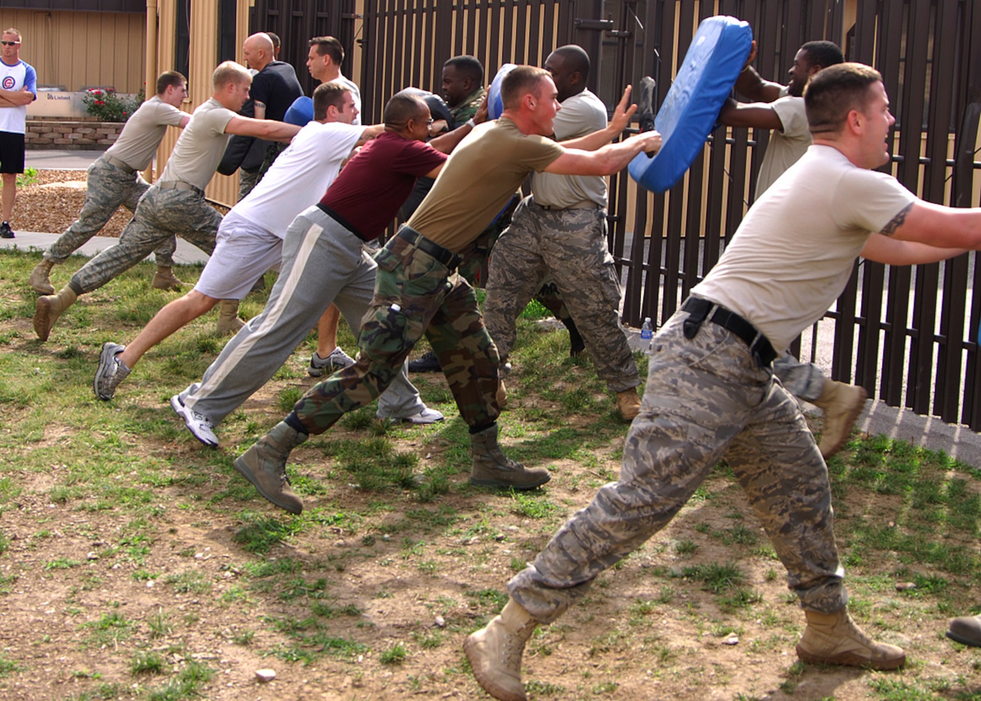 SCOTT AIR FORCE BASE, Ill. -- Members of the 375th Security Forces Squadron train along side Department of the Air Force police officer trainees in asp training. Trainees learn how to strike an assailant while protecting themselves. Twenty four civilians are scheduled to be hired to help the 375th SFS in their daily operations due to a shortage in manning. 
(US Air Force photo/Airman 1st Class Wesley Farnsworth)
