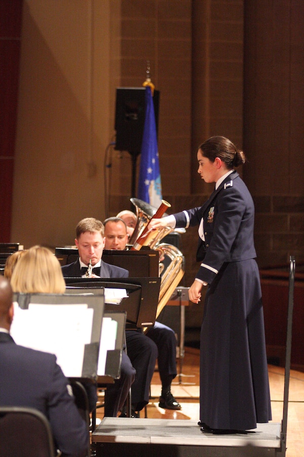 Captain Moore Urrutia conducts the Band of the West Concert Band.