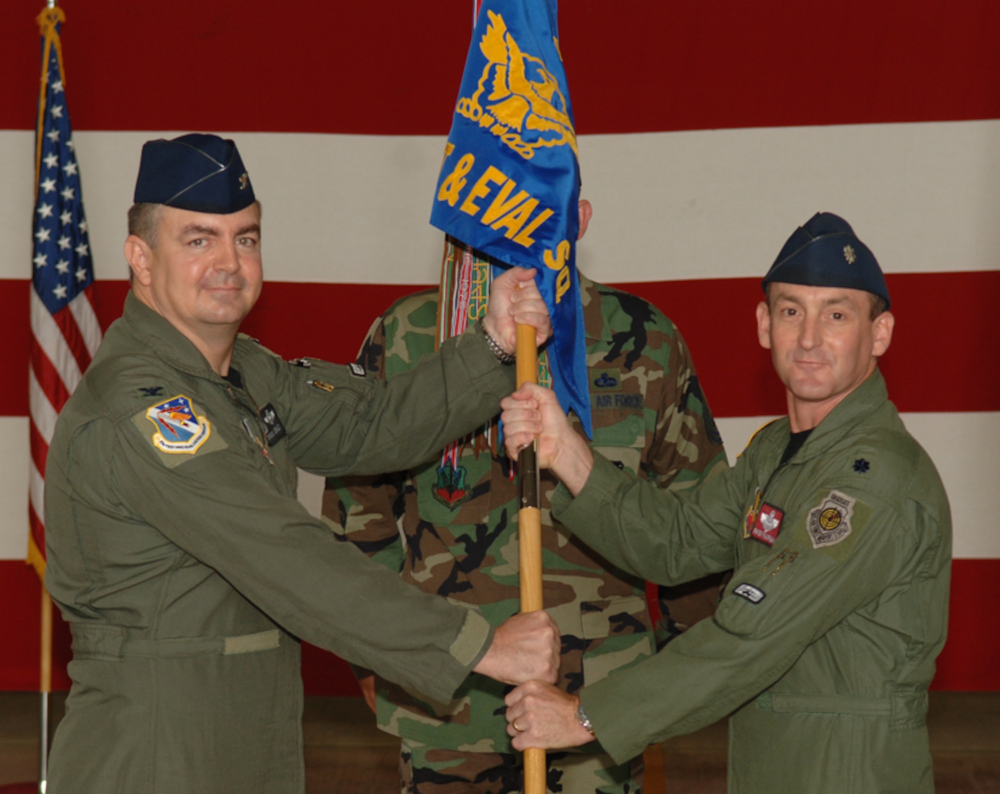Lt. Col. Randy Kaufman accepts the guidon from Col. Charles Corley, 53d Test and Evaluation Group commander, during the 337th Test and Evaluation Squadron change of command ceremony July 8 at Dyess Air Force Base, Texas.  Photo by Staff Sgt. Samuel King Jr.