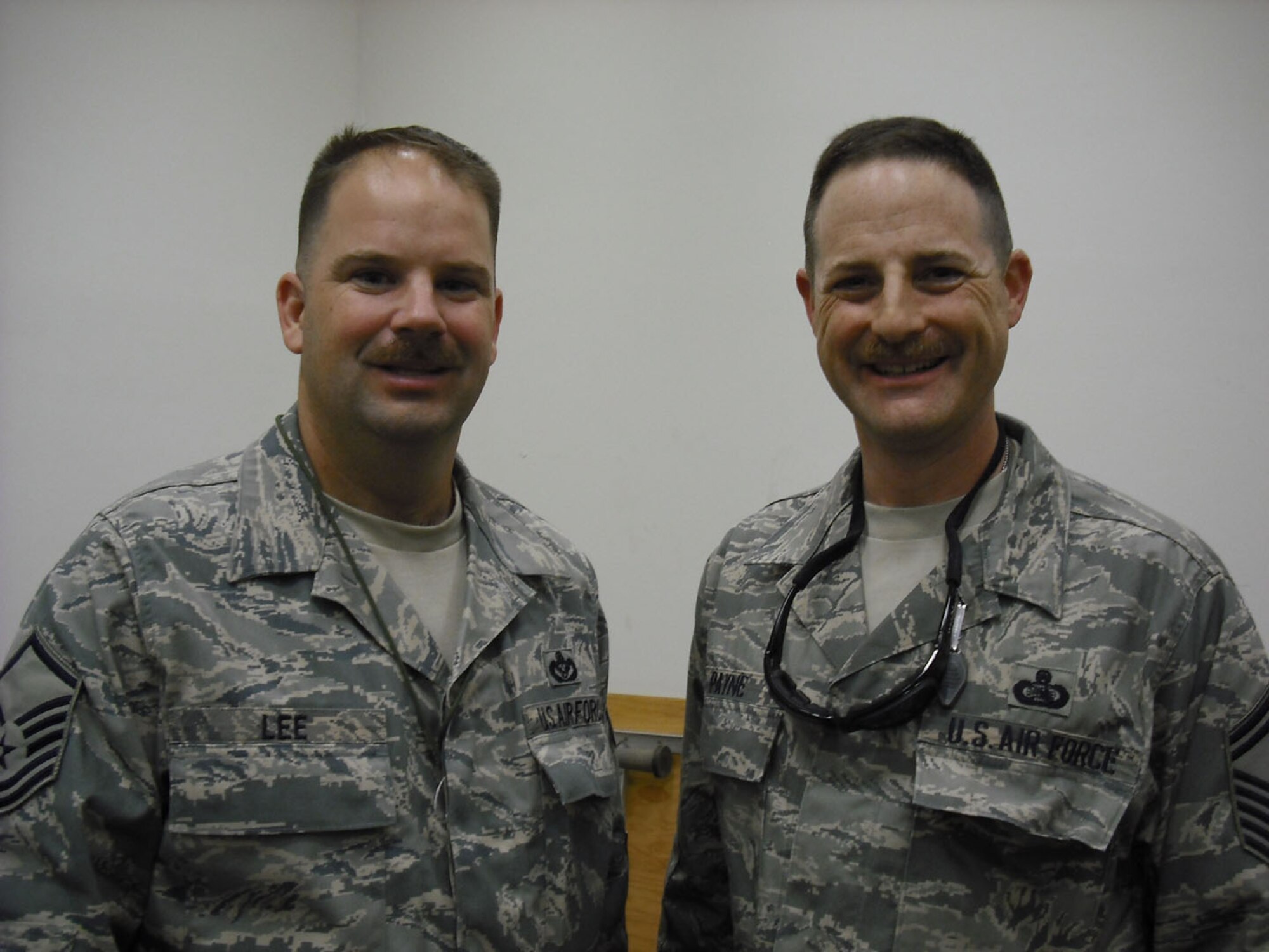 SEYMOUR JOHNSON AIR FORCE BASE, N.C -- Senior Master Sgt. Bryan Payne (right) and Master Sgt. Timothy Lee meet in Balad during a Top Three meeting there. Sgt. Payne is a Reservist with the 916th Communication Squadron and Sgt. Lee is a Reservist with the 916th Civil Engineer Squadron. Both are currently deployed to Iraq.