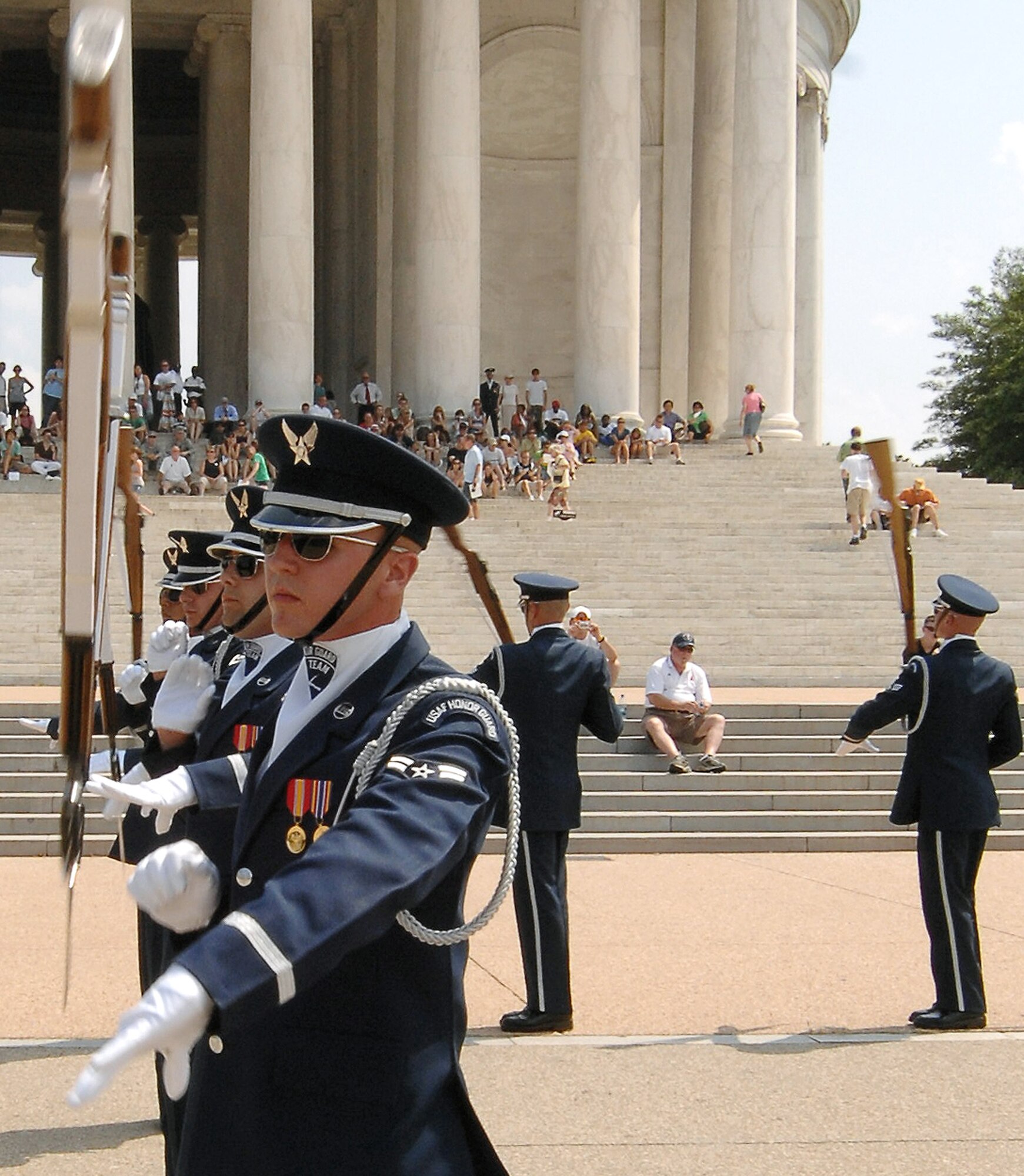 Airman 1st Class Aaron Fowler, a member of the U.S. Honor Guard Drill Team, spins a "side double" July 8 at the Jefferson Memorial in Washington D.C. as part of the team's Summer Drill Series. The team will perform around the National Capitol Region until July 29.  (U.S Air Force photo/Senior Airman Alexandre Montes) 