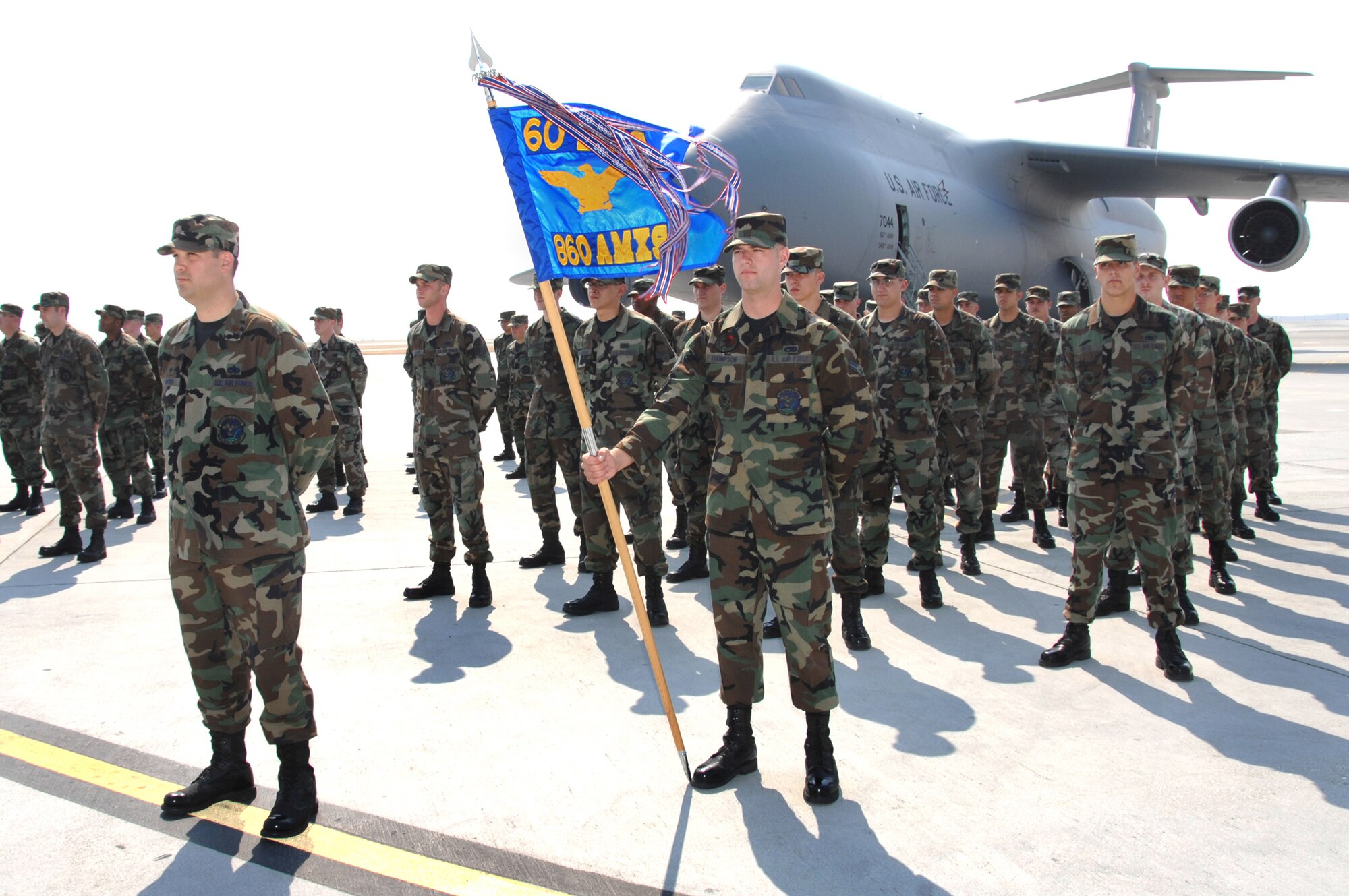 Members of the 860th Aircraft Maintenance Squadron stand in formation during the 60th Maintenance Group change-of-command ceremony July 8. Col. Craig O’Neal relinquished command to Col. Carol Johnson during the ceremony. (U.S. Air Force photo/Nan Wylie)