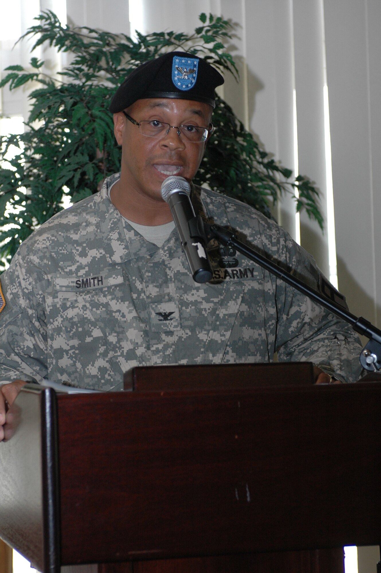 Army Col. Tracy Smith addresses members of the 402nd Field Artillery Brigade after assuming command at an assumption-of-command ceremony at Travis Air Force Base July 8. The 402nd FA Brigade conducts pre-mobilization and mobilization assistance team activities in order to train and validate select active, Reserve and National Guard, and Request for Forces Naval and Air Force units. (U.S. Air Force photo/Senior Airman Shaun Emery)