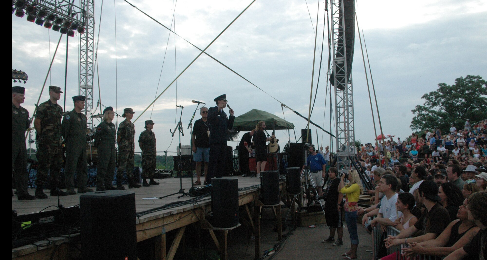 NIAGARA FALLS AIR RESERVE STATION, N.Y. - Air Force Reserve personnel from the 914th Airlift Wing were given the opportunity to raise community awareness of the Reserve program and to express their appreciation to the thousands of local supporters of the military via a free concert venue at Artpark in Lewiston, NY.  The rock band Kansas was the featured act and before the concert 914th Airlift Wing commander Col. Reinhard Schmidt spoke to a crowd of more than 15,000 to voice his appreciation for the outstanding support given to the air base by the Western New York community.  Staff Sgt. Joel Laureno, 914 AW line recruiter, sang the National Anthem while the Niagara Falls Base Honor Guard presented the colors.  A perfectly timed two ship C-130 formation flyover culminated the opening ceremony.  (U.S. Air Force photo / Tech. Sgt. Kevin Nichols)