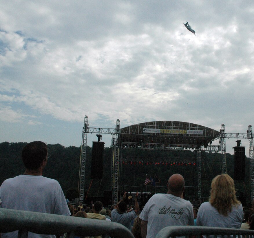 NIAGARA FALLS AIR RESERVE STATION, N.Y. - Air Force Reserve personnel from the 914th Airlift Wing were given the opportunity to raise community awareness of the Reserve program and to express their appreciation to the thousands of local supporters of the military via a free concert venue at Artpark in Lewiston, NY.  The rock band Kansas was the featured act and before the concert 914th Airlift Wing commander Col. Reinhard Schmidt spoke to a crowd of more than 15,000 to voice his appreciation for the outstanding support given to the air base by the Western New York community.  Staff Sgt. Joel Laureno, 914 AW line recruiter, sang the National Anthem while the Niagara Falls Base Honor Guard presented the colors.  A perfectly timed two ship C-130 formation flyover culminated the opening ceremony.  (U.S. Air Force photo / Tech. Sgt. Kevin Nichols)