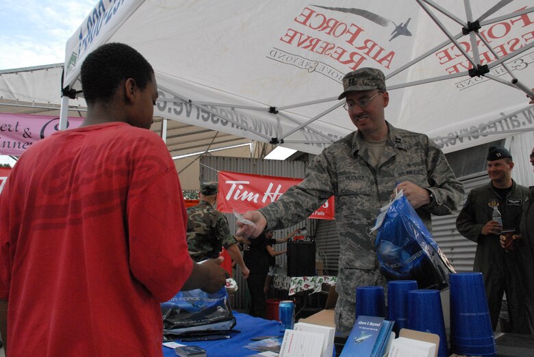 NIAGARA FALLS AIR RESERVE STATION, N.Y. - Air Force Reserve personnel from the 914th Airlift Wing were given the opportunity to raise community awareness of the Reserve program and to express their appreciation to the thousands of local supporters of the military via a free concert venue at Artpark in Lewiston, NY.  The rock band Kansas was the featured act and before the concert 914th Airlift Wing commander Col. Reinhard Schmidt spoke to a crowd of more than 15,000 to voice his appreciation for the outstanding support given to the air base by the Western New York community.  Staff Sgt. Joel Laureno, 914 AW line recruiter, sang the National Anthem while the Niagara Falls Base Honor Guard presented the colors.  A perfectly timed two ship C-130 formation flyover culminated the opening ceremony.  (U.S. Air Force photo / Airman 1st Class Andrew Caya)