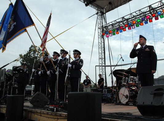 NIAGARA FALLS AIR RESERVE STATION, N.Y. - Air Force Reserve personnel from the 914th Airlift Wing were given the opportunity to raise community awareness of the Reserve program and to express their appreciation to the thousands of local supporters of the military via a free concert venue at Artpark in Lewiston, NY.  The rock band Kansas was the featured act and before the concert 914th Airlift Wing commander Col. Reinhard Schmidt spoke to a crowd of more than 15,000 to voice his appreciation for the outstanding support given to the air base by the Western New York community.  Staff Sgt. Joel Laureno, 914 AW line recruiter, sang the National Anthem while the Niagara Falls Base Honor Guard presented the colors.  A perfectly timed two ship C-130 formation flyover culminated the opening ceremony.  (U.S. Air Force photo / Airman 1st Class Andrew Caya)