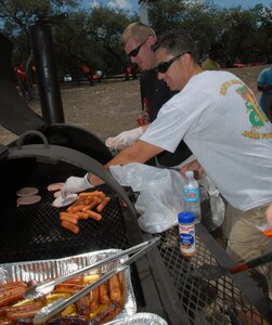 Airmen spent the day at the first-ever Airmens' Summer Bash at Canyon Lake Recreation Park July 11. The event featured a cookout, sporting events, a disc jockey and interactions with base leadership. (U.S. Air Force photos by Rich McFadden)