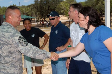 Airmen spent the day at the first-ever Airmens' Summer Bash at Canyon Lake Recreation Park July 11. The event featured a cookout, sporting events, a disc jockey and interactions with base leadership. (U.S. Air Force photos by Rich McFadden)