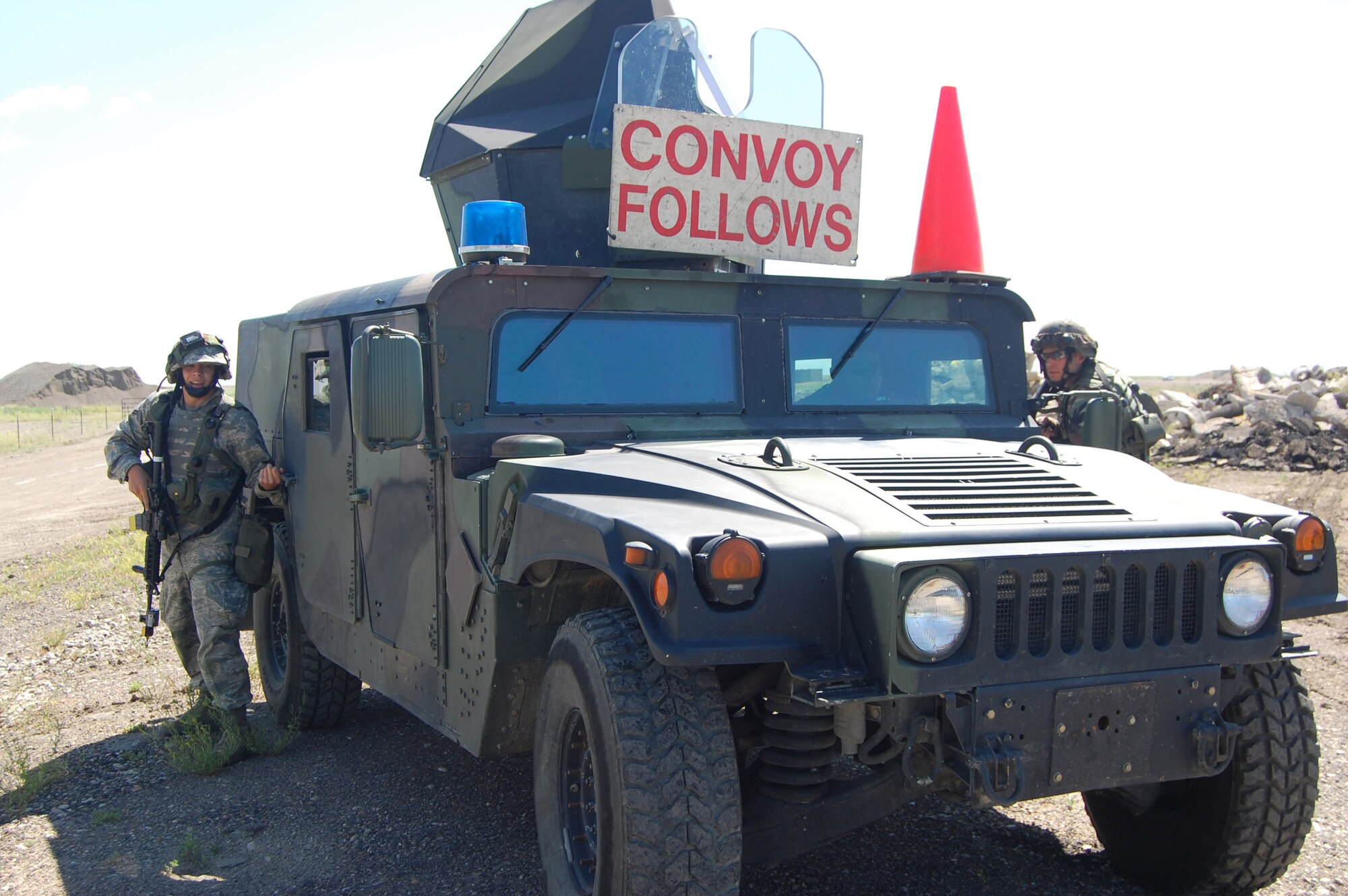 Security Forces Airmen check a Humvee for threatening individuals during an exercise here July 10. This was a no-notice exercise to gauge real-world response to an internal threat to any part of Malmstrom's weapon system. (U.S. Air Force photo/Airman 1st Class Emerald Ralston)