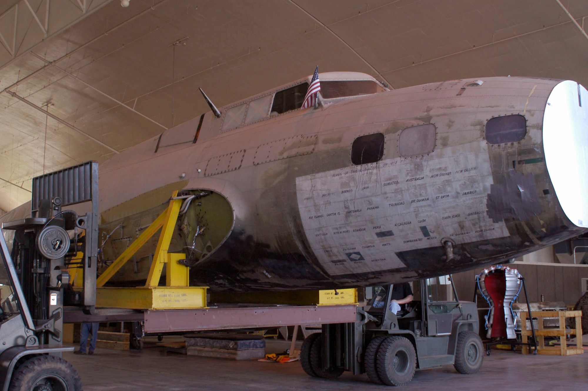 Restoration crews work together to unload the fuselage of the B-17D The Swoose that recently arrived at the National Museum of the U.S. Air Force near Dayton, Ohio, from the National Air and Space Museum in Washington D.C. (U.S. Air Force photo)                             