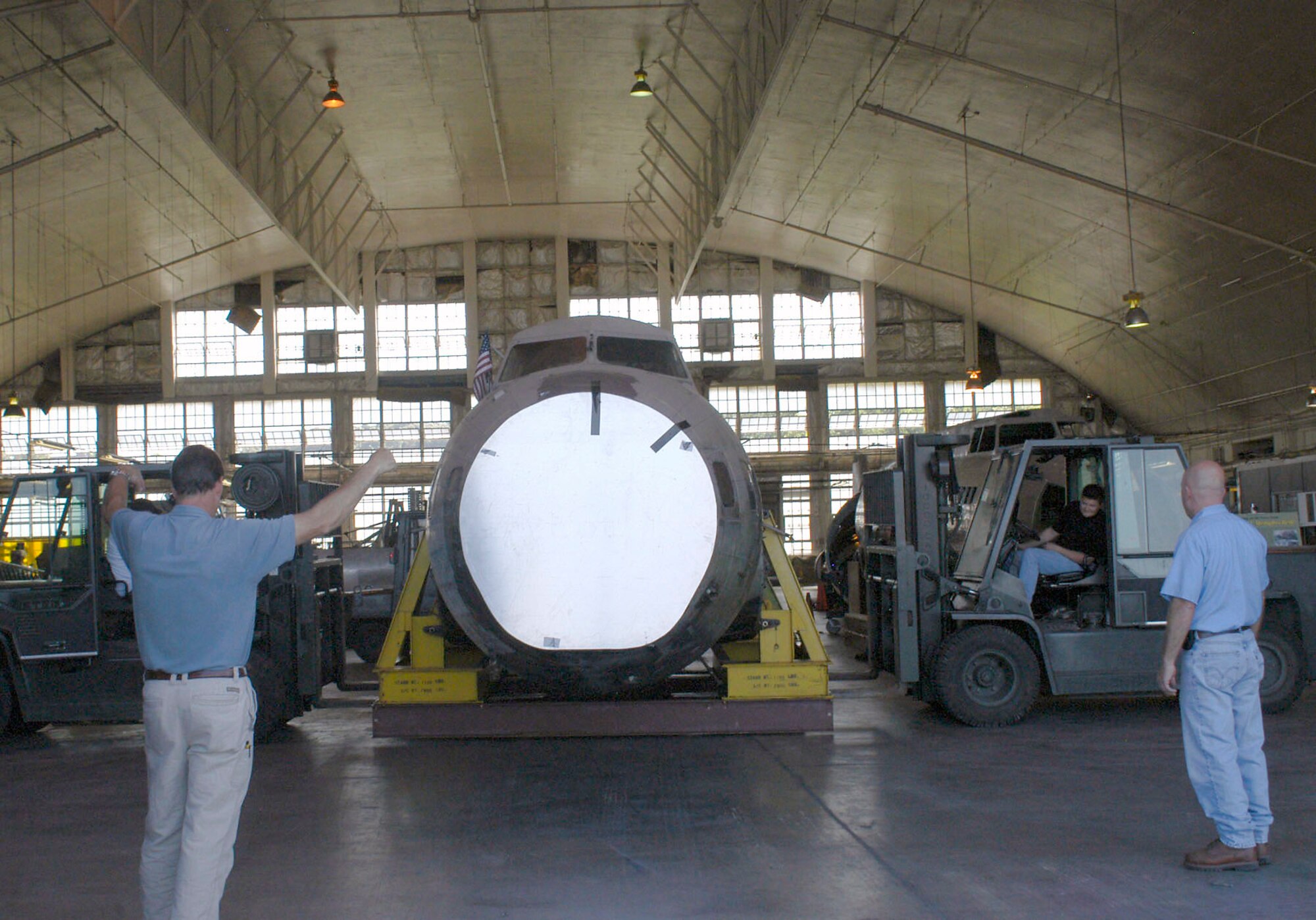 Restoration crews work together to unload the fuselage of the B-17D The Swoose that recently arrived at the National Museum of the U.S. Air Force near Dayton, Ohio from the National Air and Space Museum in Washington D.C. (U.S. Air Force photo)                                