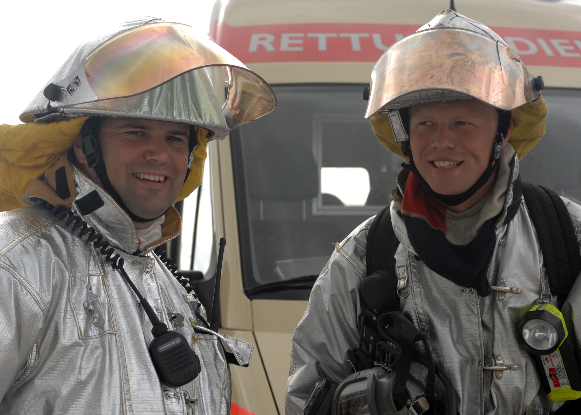 SPANGDAHLEM AIR BASE, Germany-- Herr Frank Weis and Staff Sgt. Eric Ackerman, both Fire Fighters from the 52nd Civil Engineer Squadron, celebrate after the completion of the Mutual Aid Agreement Validation Exercise July 12, 2008. Emergency responders from the Air Base as well as the surrounding communities joined together to practice emergency response to help bridge language and response technique barriers. U.S. Air Force Photo by Airman 1st Class Jenifer Calhoun.