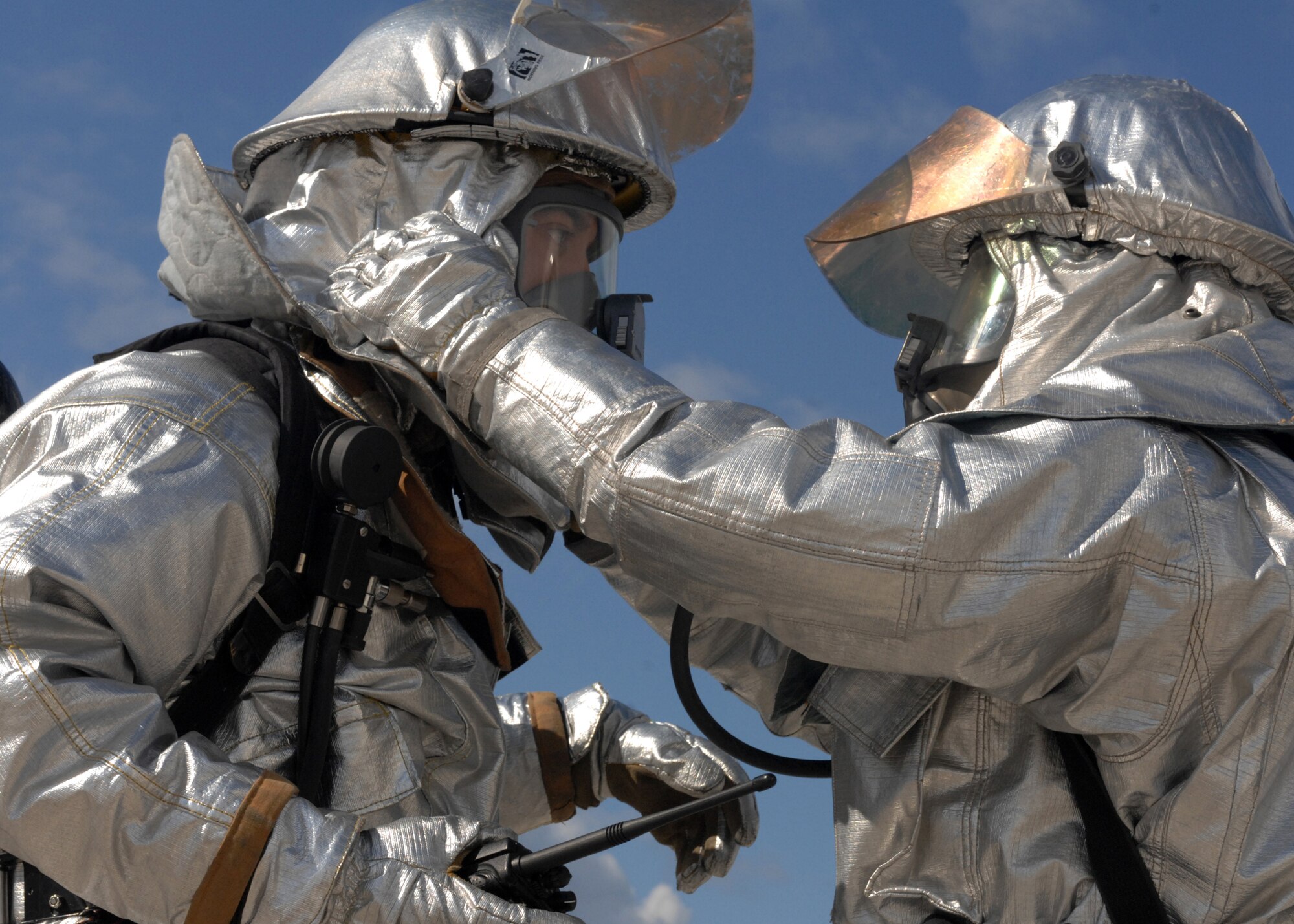 SPANGDAHLEM AIR BASE, Germany-- Fire Fighters from the 52nd Civil Engineer Squadron check their gear during the Mutual Aid Agreement Validation Exercise July 12, 2008. Emergency responders from the Air Base as well as the surrounding communities joined together to practice emergency response to help bridge language and response technique barriers. U.S. Air Force Photo by Airman 1st Class Jenifer Calhoun.