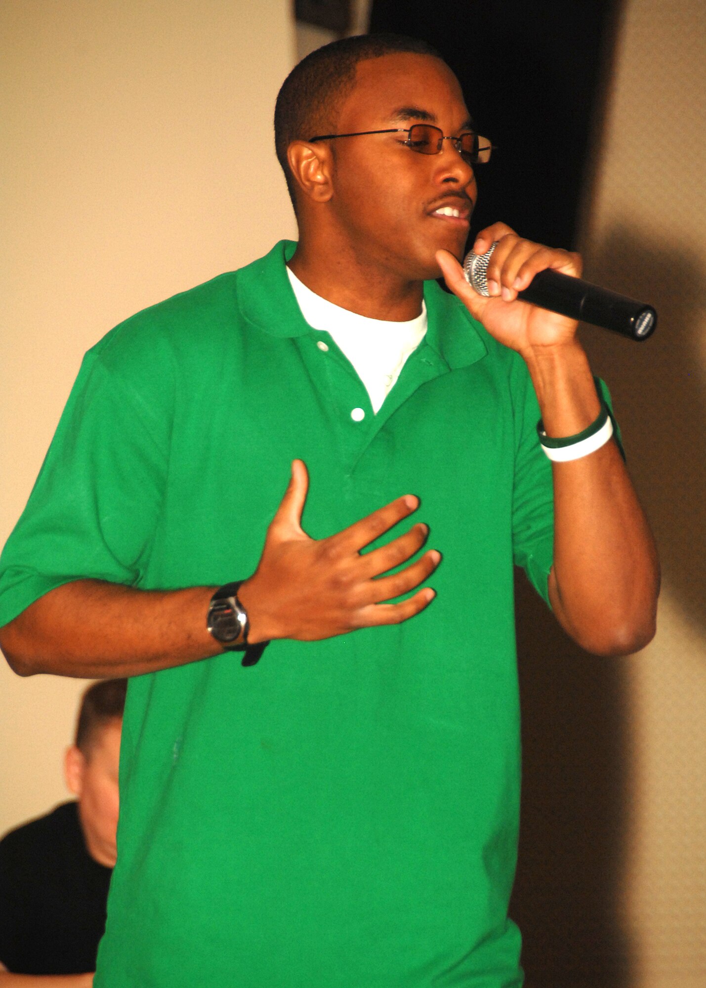 SOUTHWEST ASIA -- Senior Airman Rashaud Phillips, deployed to the 386th Expeditionary Force Support Squadron, sings “Apologize” by rock group One Republic during the Desert Idol competition on July 13 at a base in Southwest Asia. The 386th Expeditionary Force Support Squadron sponsored the event, which had three rounds of judging. Airman Phillips was crowned the runner-up and awarded a prize of $100. Airman Phillips is deployed from the 126th Air Refueling Wing, Scott Air Force Base, Ill. (U.S. Air Force photo/Tech. Sgt. Raheem Moore)
