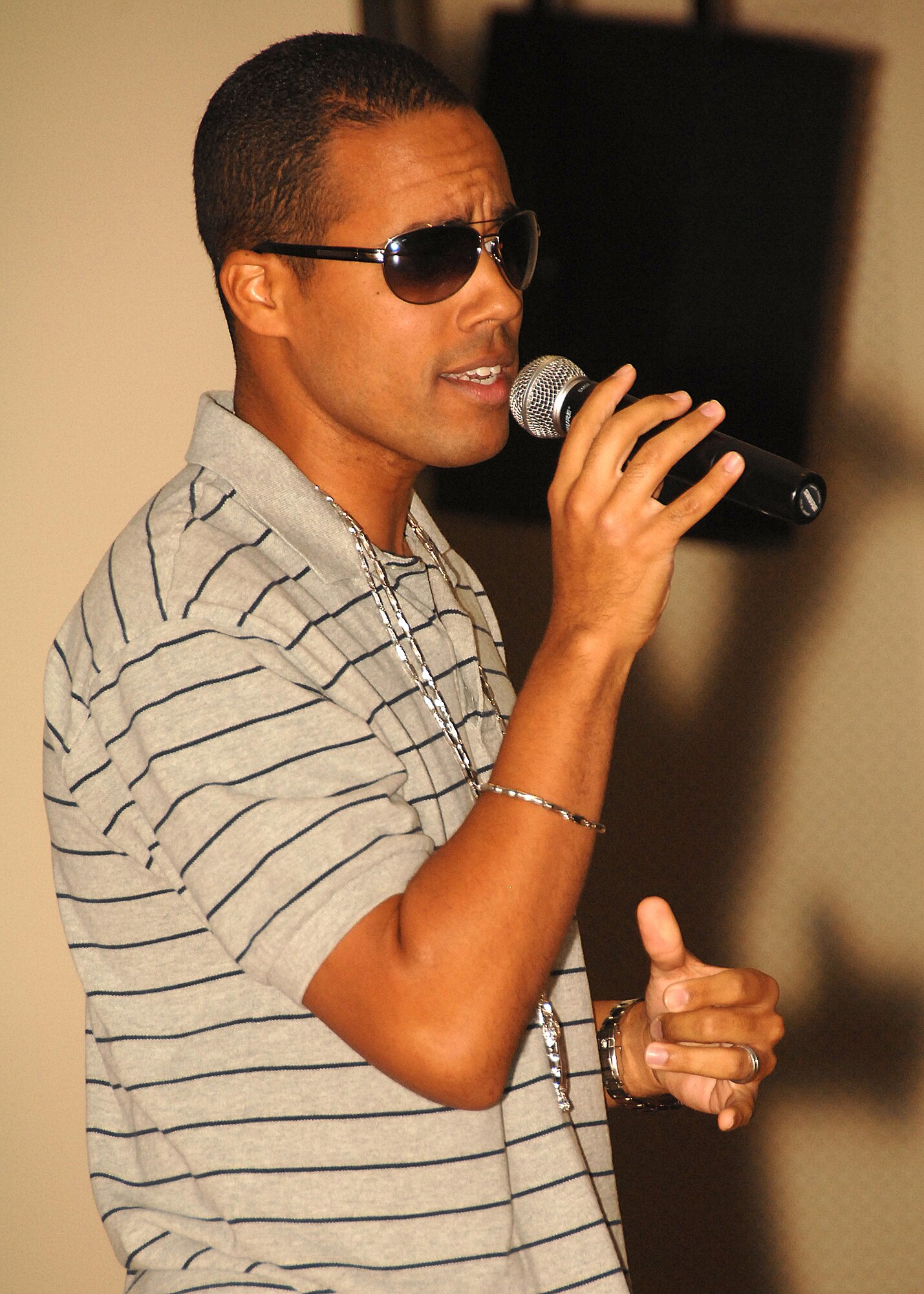 SOUTHWEST ASIA -- Staff Sgt. Eric Sanchez, deployed to the 386th Expeditionary Logistics Readiness Squadron, sings rhythm and blues artist Montel Jordan’s “This Is How We Do It” during the Desert Idol competition on July 13 at a base in Southwest Asia. The 386th Expeditionary Force Support Squadron sponsored the event, which had three rounds of judging. Sergeant Sanchez was crowned the winner, and was awarded a prize for $150. Sergeant Sanchez is deployed from the Portland Air National Guard, Ore. (U.S. Air Force photo/Tech. Sgt. Raheem Moore)