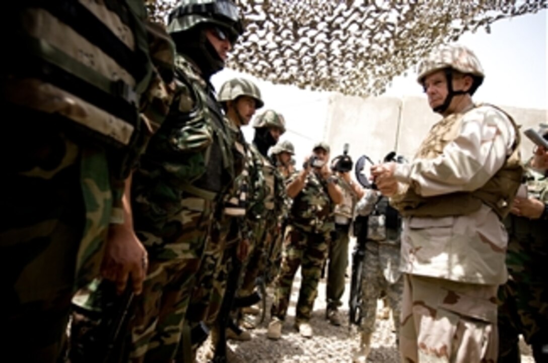 Chairman of the Joint Chiefs of Staff Adm. Mike Mullen, U.S. Navy, addresses Iraqi army troops at Combat Outpost Rabiy in Mosul, Iraq, on July 8, 2008.  Mullen thanked the troops for their dedication and sacrifice.  Mullen is on a six-day tour to visit troops and host a USO gathering.  
