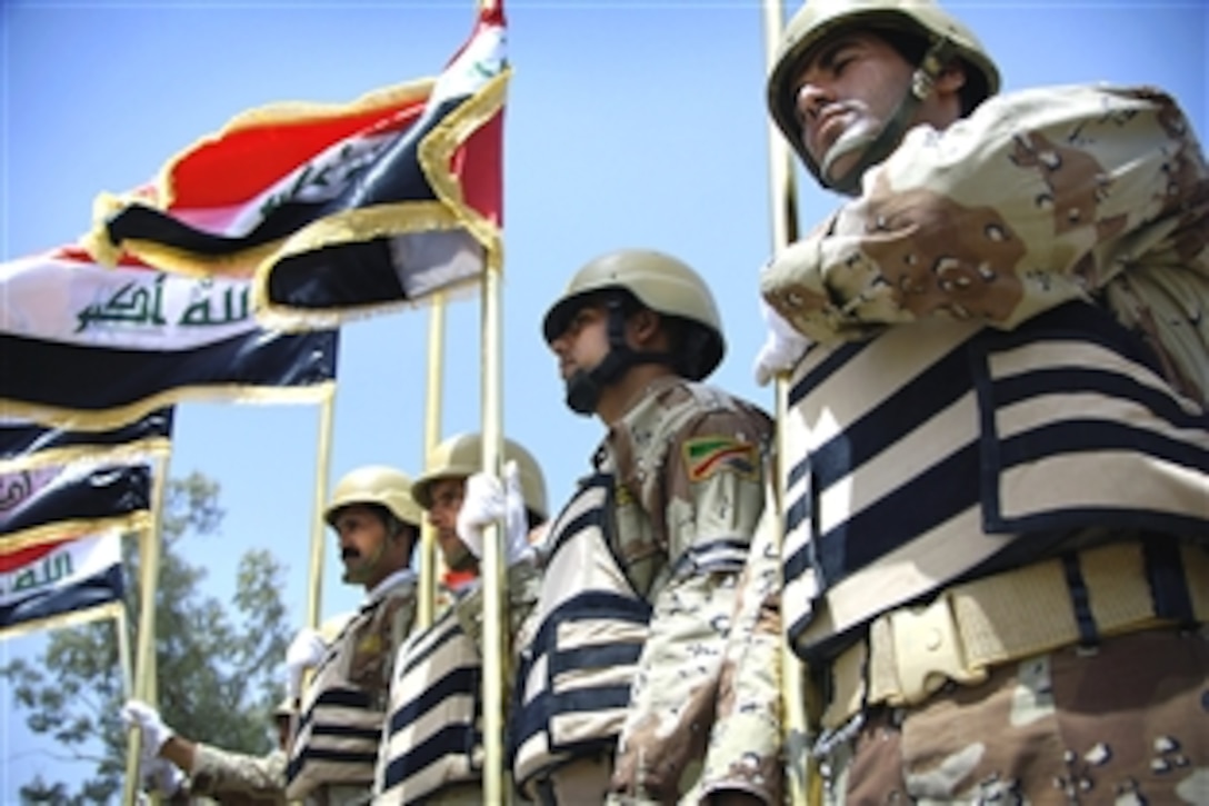 Iraqi soldiers assigned to the 4th Battalion Mechanized, 36th Brigade, 9th Iraqi Army Division, prepare to march during their graduation ceremony on Camp Taji, Iraq, July 10, 2008. The troops graduated from a two-week course in advanced skills training. 
