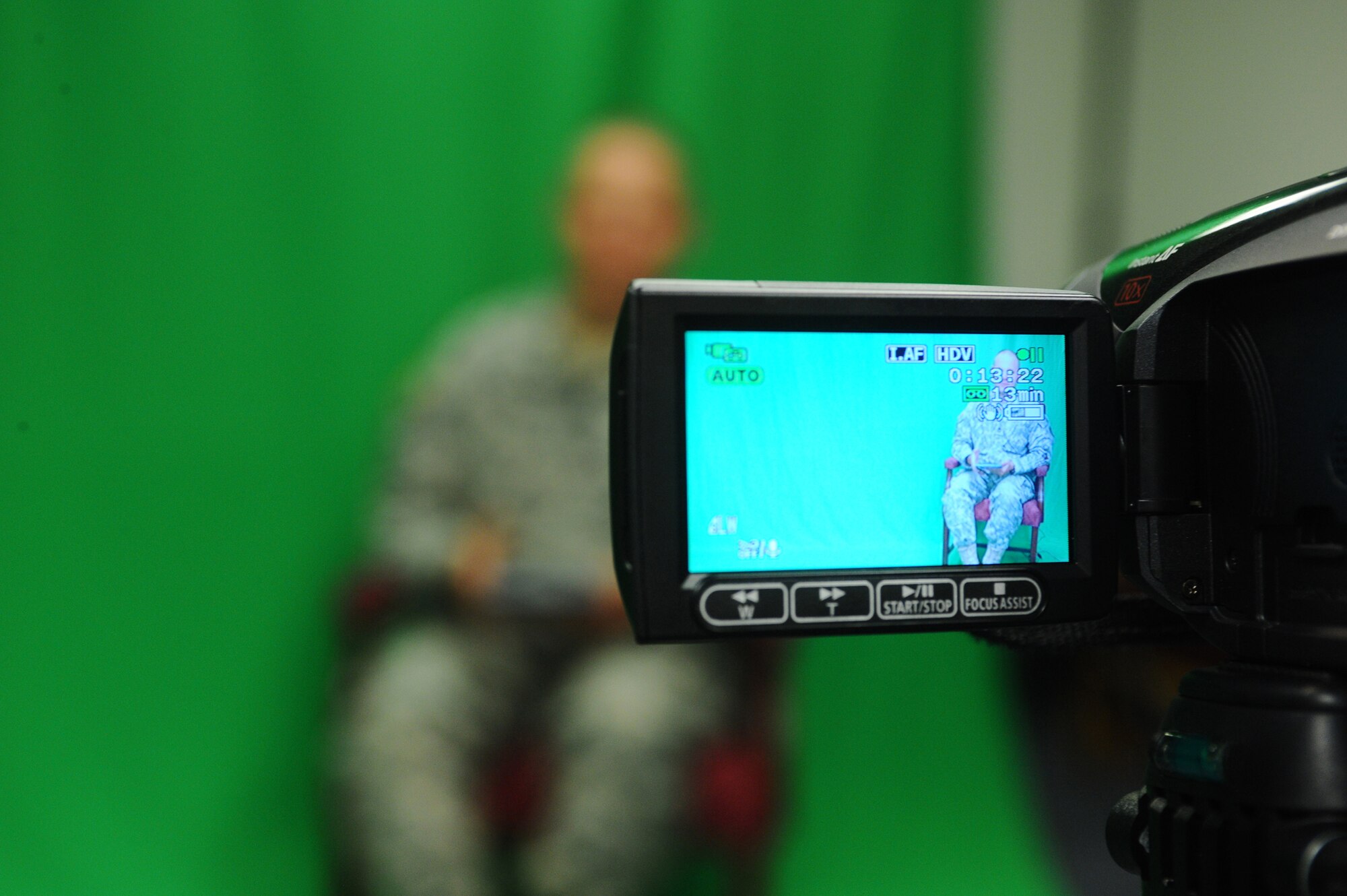 Staff Sgt. James Warren, 354th Fighter Wing chaplain's assistant, and his wife, Shelly, decided to put their video editing skills and altruism to use by videotaping deploying Airmen and Soldiers in the local area while they read bedtime stories to their children free of charge. Pictured here, Army Sgt. 1st Class Maynard Hinkle, Task Force Saber, 6th Squadron, 17th Calvary, reads The Cat in the Hat July 16, 2008 at Fort Wainwright. Sergeant Hinkle has been on many deployments, including Afghanistan and Bosnia and has never, until now, had the capability to communicate via video recording to his children. (U.S. Air Force photo by Airman 1st Class Jonathan Snyder)