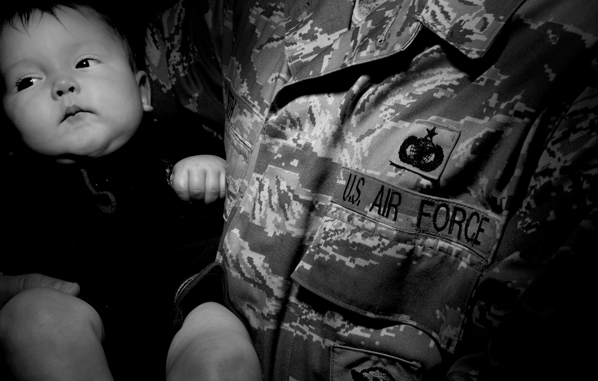 Deploying in support of military operations over the world can cause many hardships on Air Force families. Many male Airmen have been deployed during the birth of their children. Staff Sgt. Ryan Veith, who is holding his son R.J., missed the birth of his first son due to his recent deployment to Iraq from September 2007 to February 2008. According to him, it took about a week after his return for his son R.J to smile at him. Father and son are still working through the bonding process. Sergeant Veith is a military working dog handler for the 354th Security Forces Squadron Eielson, Air Force Base, Alaska. He Veith has deployed eight times and is set to leave for his ninth deployment this July.

( U.S Air Force photo by TSgt Eric T. Sheler)
