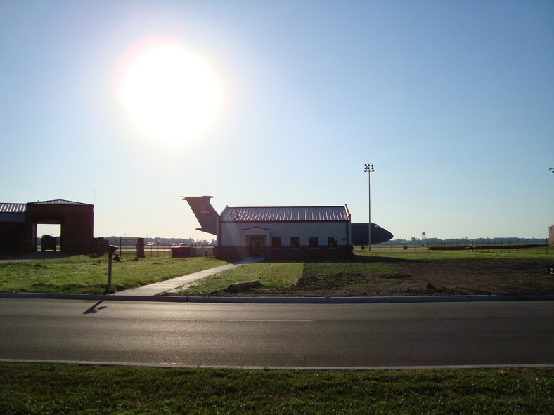 It appears that an aircraft is using the flight kitchen of the 932nd Airlift Wing as a mini hangar, however, this is an optical illusion as the plane was directly behind the building.  It was noticed by Tech Sgt. April Tarbill one morning on her way to work as a flight attendant for the Air Force Reserve Command.