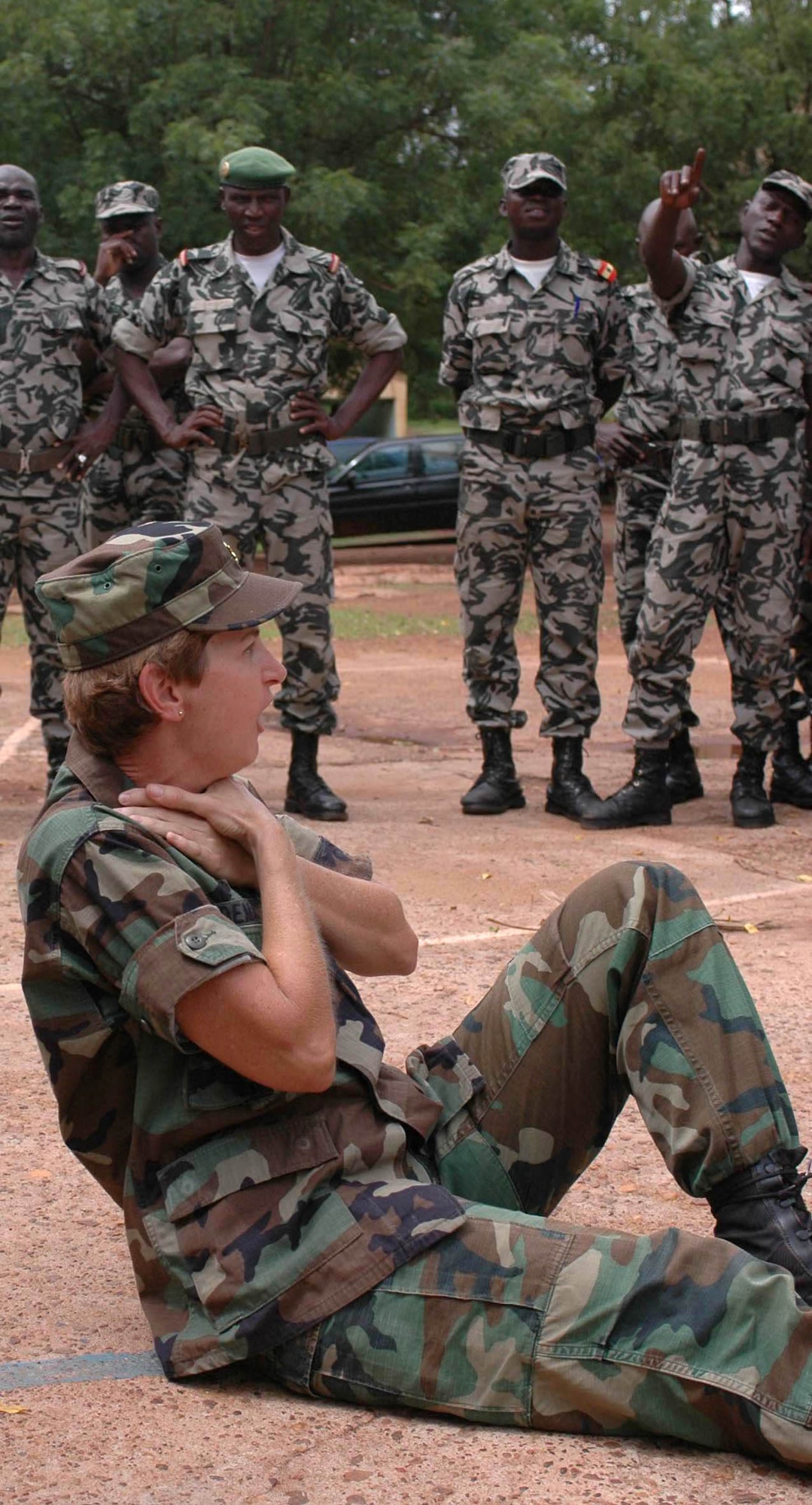 Maj. Linda Demary simulates not being able to breath during a triage assessment training July 15 in the village of Kati. Malian medics and nurses learned how to handle patients in a mass casualty scenario during MEDFLAG 08. Major Demary is assigned to the 31st Medical Group, Aviano Air Base, Italy. (U.S. Air Force photo/Senior Airman Justin Weaver)