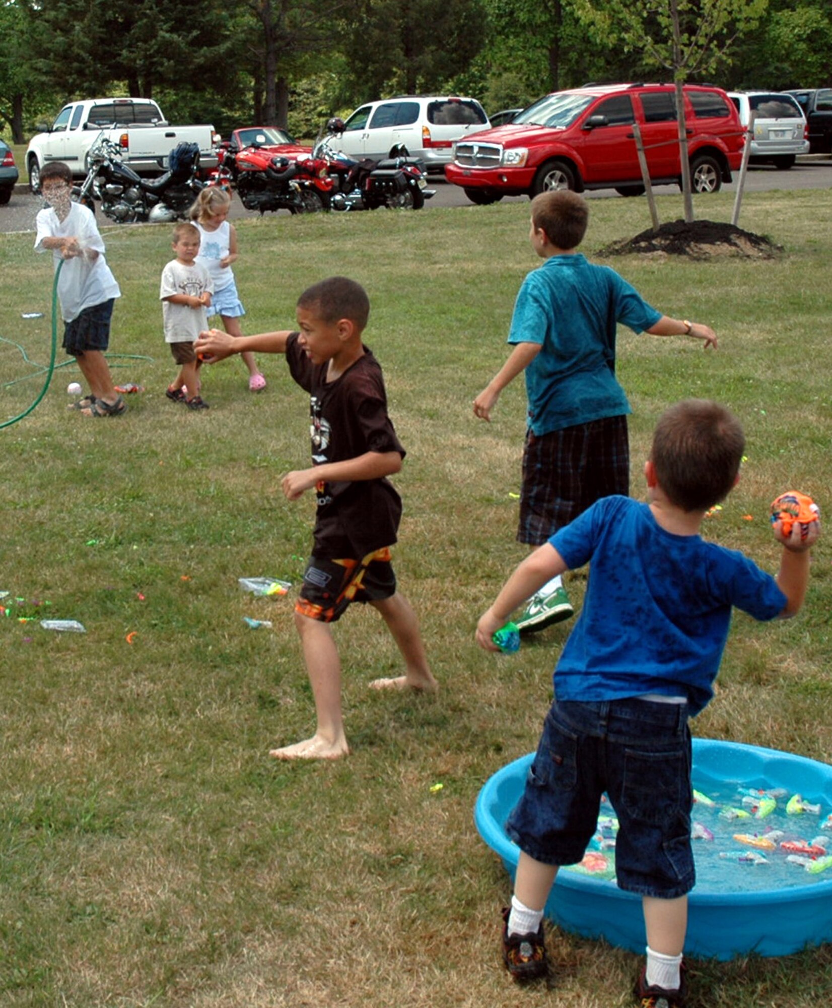 Children play with water and make water balloons during the U.S. Air Force Expeditionary Center annual picnic July 11, 2008, on Fort Dix, N.J.  (U.S. Air Force Photo/Staff Sgt. Paul R. Evans)