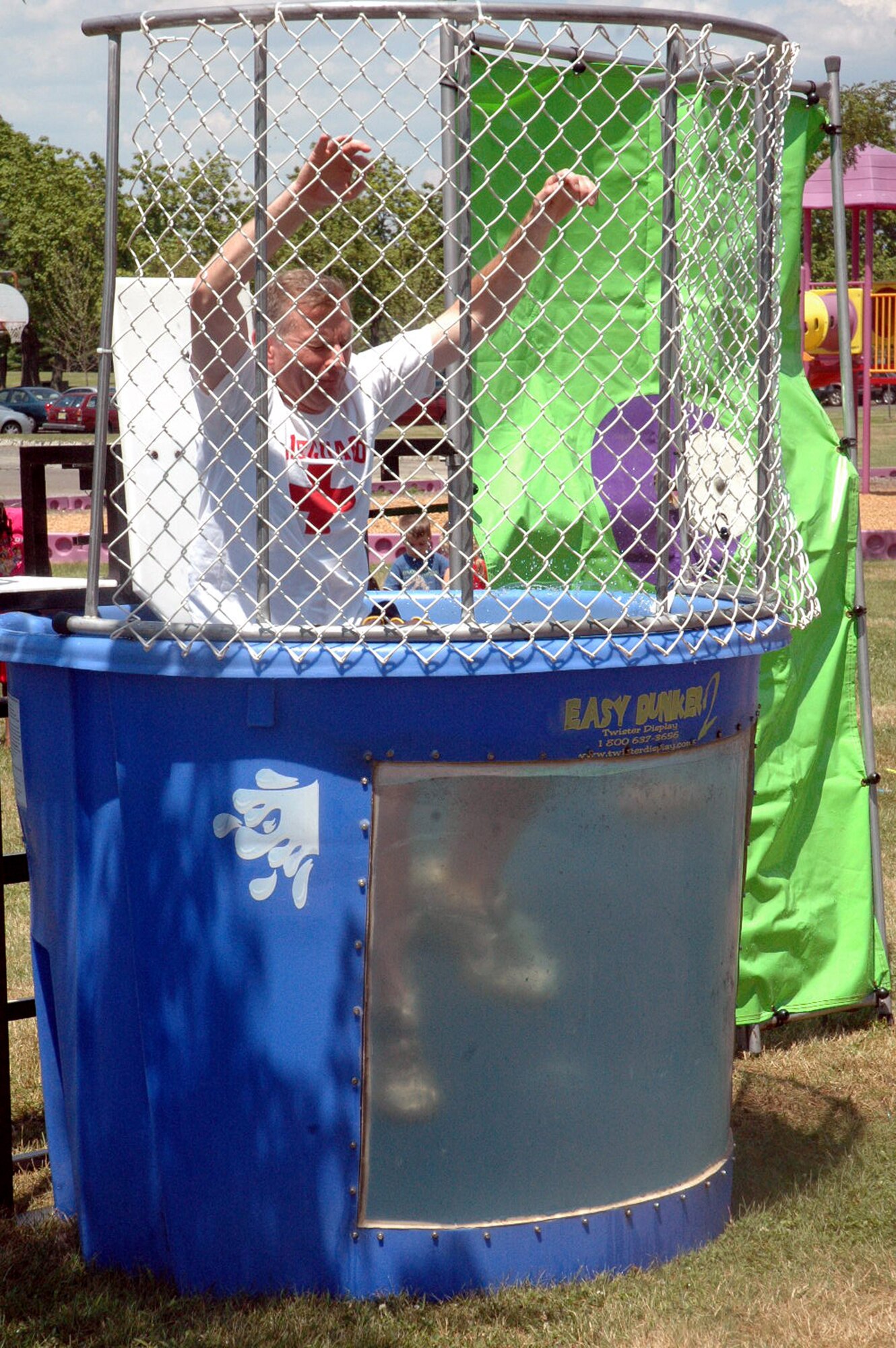 Chief Master Sgt. Jeffry Helm, U.S. Air Force Expeditionary Center command chief master sergeant, takes his first plunge in dunk tank on Fort Dix, N.J., July 11, 2008, during activities for the USAF EC annual picnic.  (U.S. Air Force Photo/Tech. Sgt. Scott T. Sturkol)