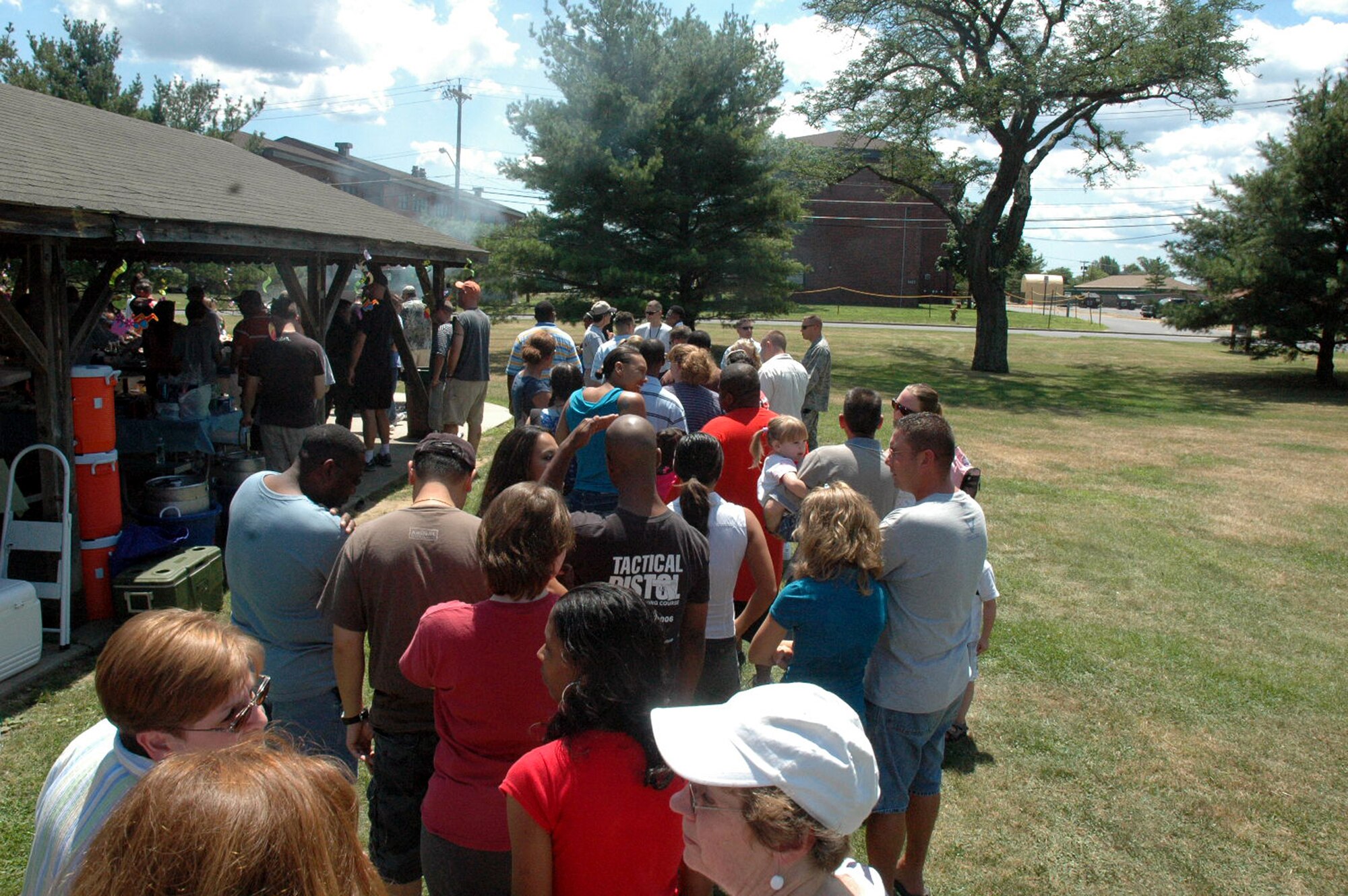 U.S. Air Force Expeditionary Center "Eagles" and their families get in line for food on Fort Dix, N.J., July 11, 2008, during activities for the USAF EC annual picnic.  (U.S. Air Force Photo/Tech. Sgt. Scott T. Sturkol)