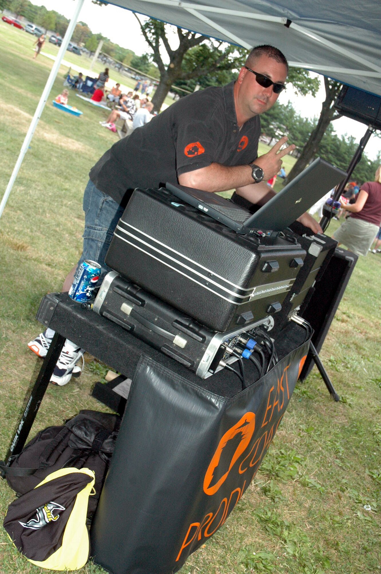 Tech. Sgt. Jeffrey Dean, 421st Combat Training Squadron, takes on the duties of emcee and the music "d-jay" during the U.S. Air Force Expeditionary Center annual picnic July 11, 2008, on Fort Dix, N.J.  (U.S. Air Force Photo/Tech. Sgt. Scott T. Sturkol)