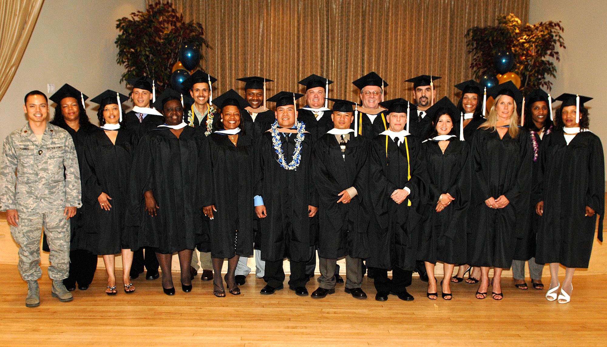 The annual graduation ceremony for Los Angeles Air Force Base's branch of Webster University was held at Fort MacArthur, San Pedro, Calif., and was attended by family, friends, co-workers, and instructors, June 13. The 2008 graduates were:  (1st row, left to right) Maj. Randy Flores, Glenda Watkins, Dormey Blankmann, Diana Dunlap, Capt. Rolando Dagoc, Master Sgt. Anh Pham, *James Scroggins, Staff Sgt. Maria Smith, *Gail Wright, and Jessie Moore, (2nd row, left to right) Nedra Williams, 2nd Lt. Nesta Garner, *Salvador Ramirez, Maj. Donny White, Francis Whalen, Jr., *Ken Merriman, Leonardo Salazar, Felicia Hairrington, Iona Winston. (* indicates graduated with honors.)  Webster University offers degrees in Master of Business Administration, Master of Arts in Management & Leadership, Master of Arts in Procurement and Acquisitions Management, and Master of Arts in Business and Organizational Management. The program is open to all military and civilian employees.  For details, contact the base representative at 310-607-8005.  (Photo by Steven Schester)