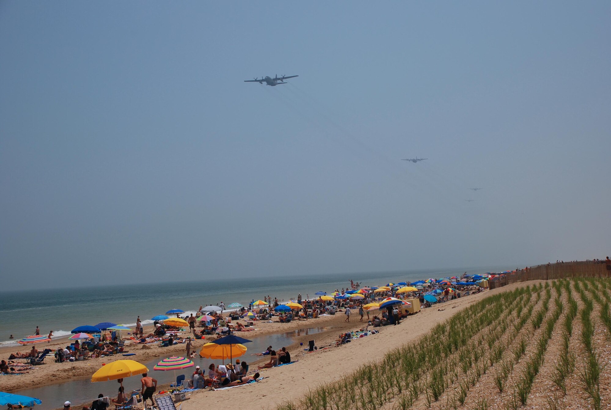 A five-ship large formation of Delaware Air National Guard C-130 transport aircraft from the 166th Airlift Wing in New Castle, Del. in flight heading north offshore from Bethany Beach, Delaware during a 700-mile, three-hour training flight on June 7, 2006 over four states (Del., Md., Va., and N.J.) culminating in an airdrop over Coyle Field, N.J. and a return to home station at New Castle Airport, Del.