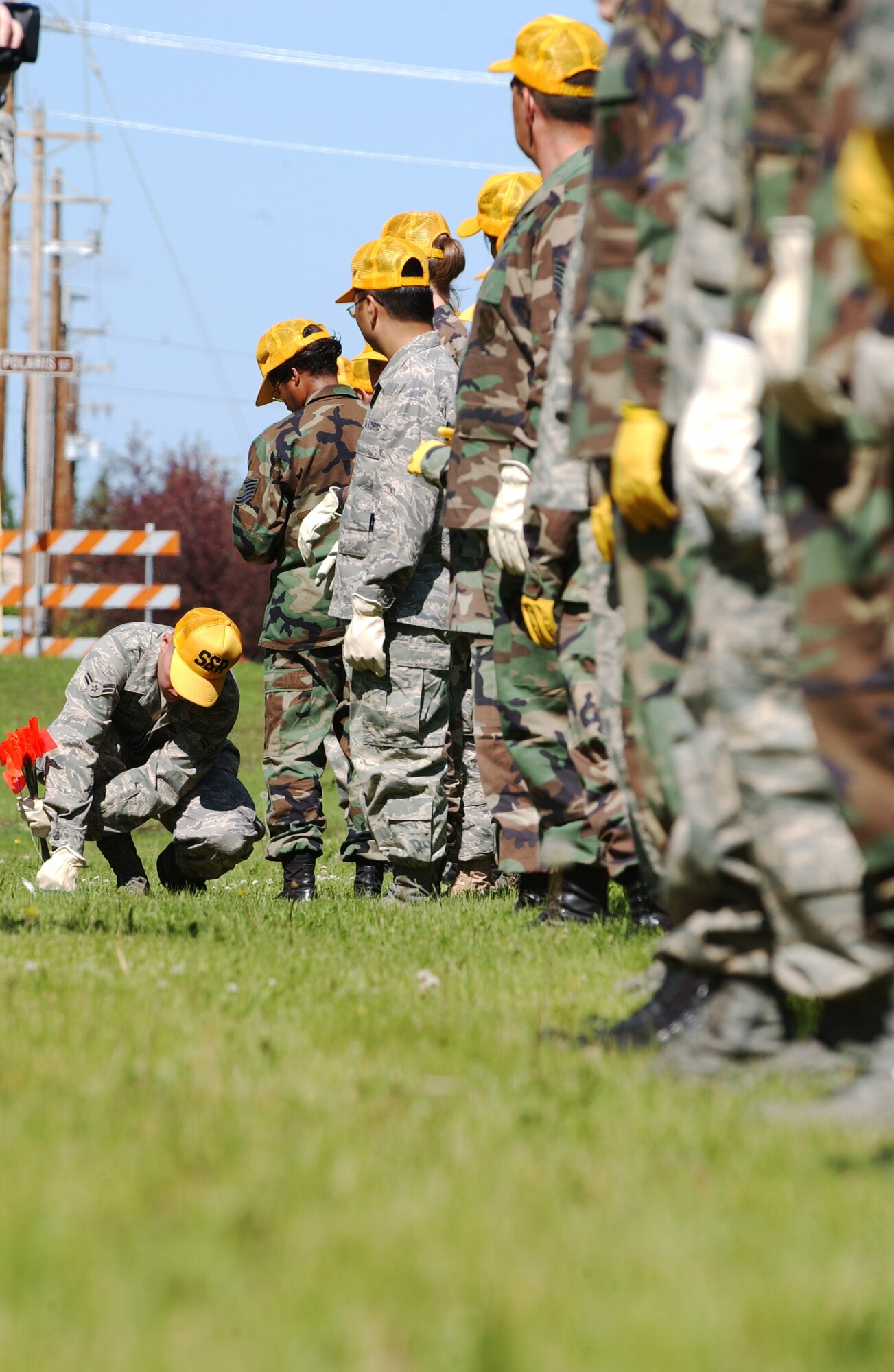 Airman of the 354th Force Support Squadron stop after someone found evidence during the search and recovery exercise July 15, 2008 at Eielson Air Force Base, Alaska. 354th FSS Airmen form a single line and step in unison covering ground while searching for any evidence that will be needed to be marked and plotted. (U.S. Air Force Photo/Airman 1st Class Jonathan Snyder)
(Released)