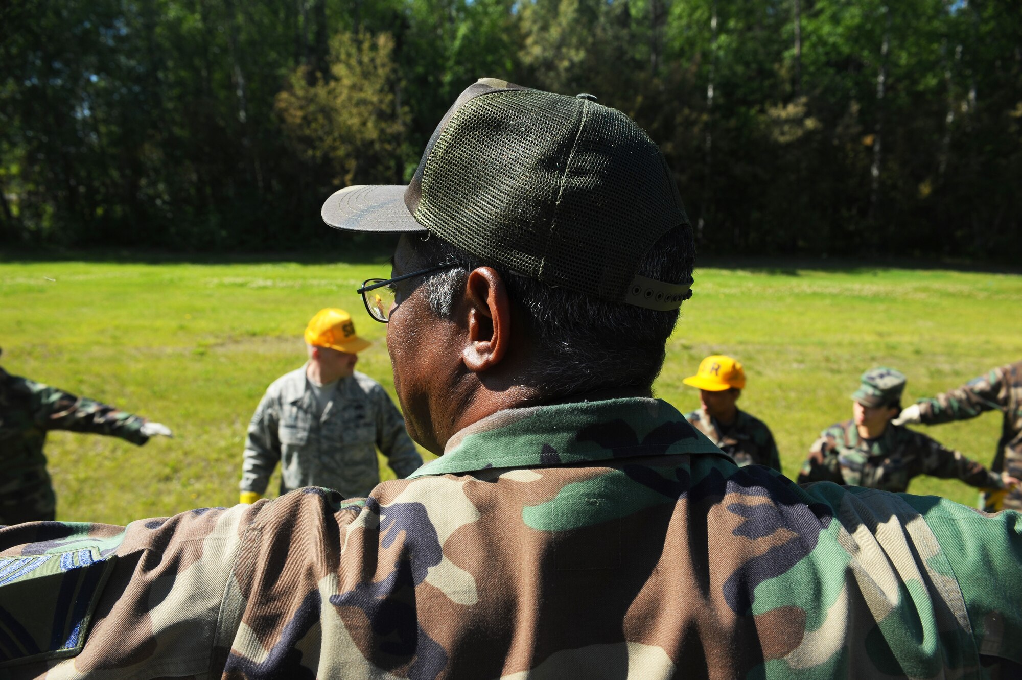Senior Master Sgt. Cleofas Trejo demonstrates to the search and recovery team what they should do while preparing for a search and recovery exercise July 15, 2008, at Eielson Air Force Base, Alaska. Airman of the 354th Force Support Squadron form a single line and step in unison covering ground while searching for any evidence that will be needed to be marked and plotted.
(U.S. Air Force Photo/Airman 1st Class Jonathan Snyder) (Released)