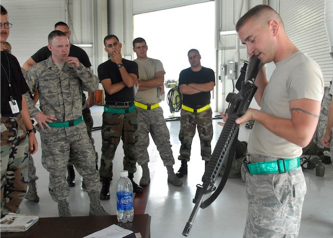 Senior Airman Michael Reed demonstrates a function check on an M-16 rifle July 16 at Charleston AFB. Airmen across the base are participating in weekly exercises to prepare for the Headquarters Air Mobility Command operational readiness inspection in August. Airman Reed is a structural maintainer with the 437th Maintenance Squadron. (U.S. Air Force photo/Airman 1st Class Cynthia Spalding)