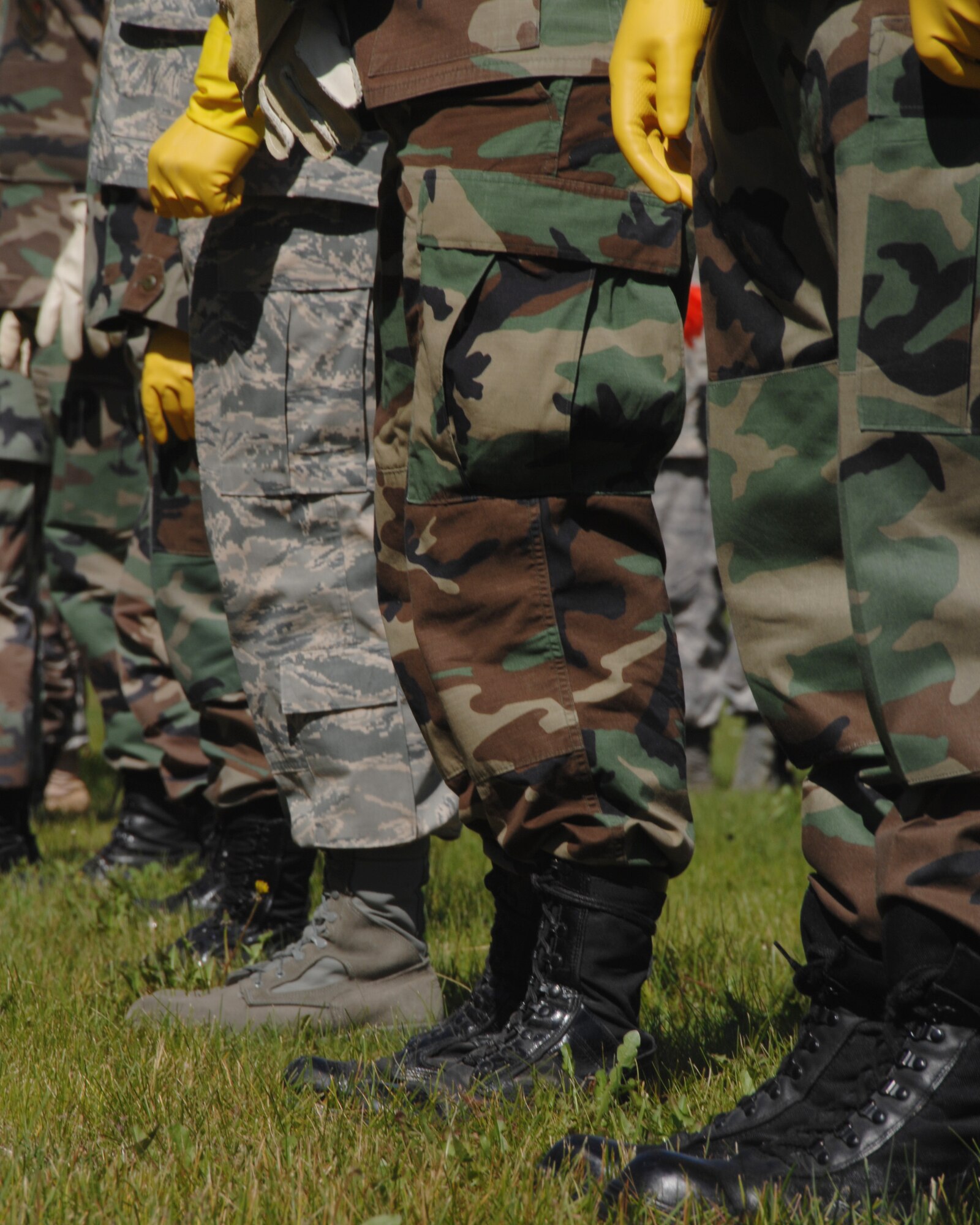 Members of the 354th Force Support Squadron emergency response search and recovery team conduct a sweep of a simulated aircraft mishap during a search and recovery exercise July 15, 2008. The exercise was designed to provide a realistic aircraft crash training scenario for emergency teams.  (U.S. Air Force photo/Staff Sgt. Tia Schroeder)