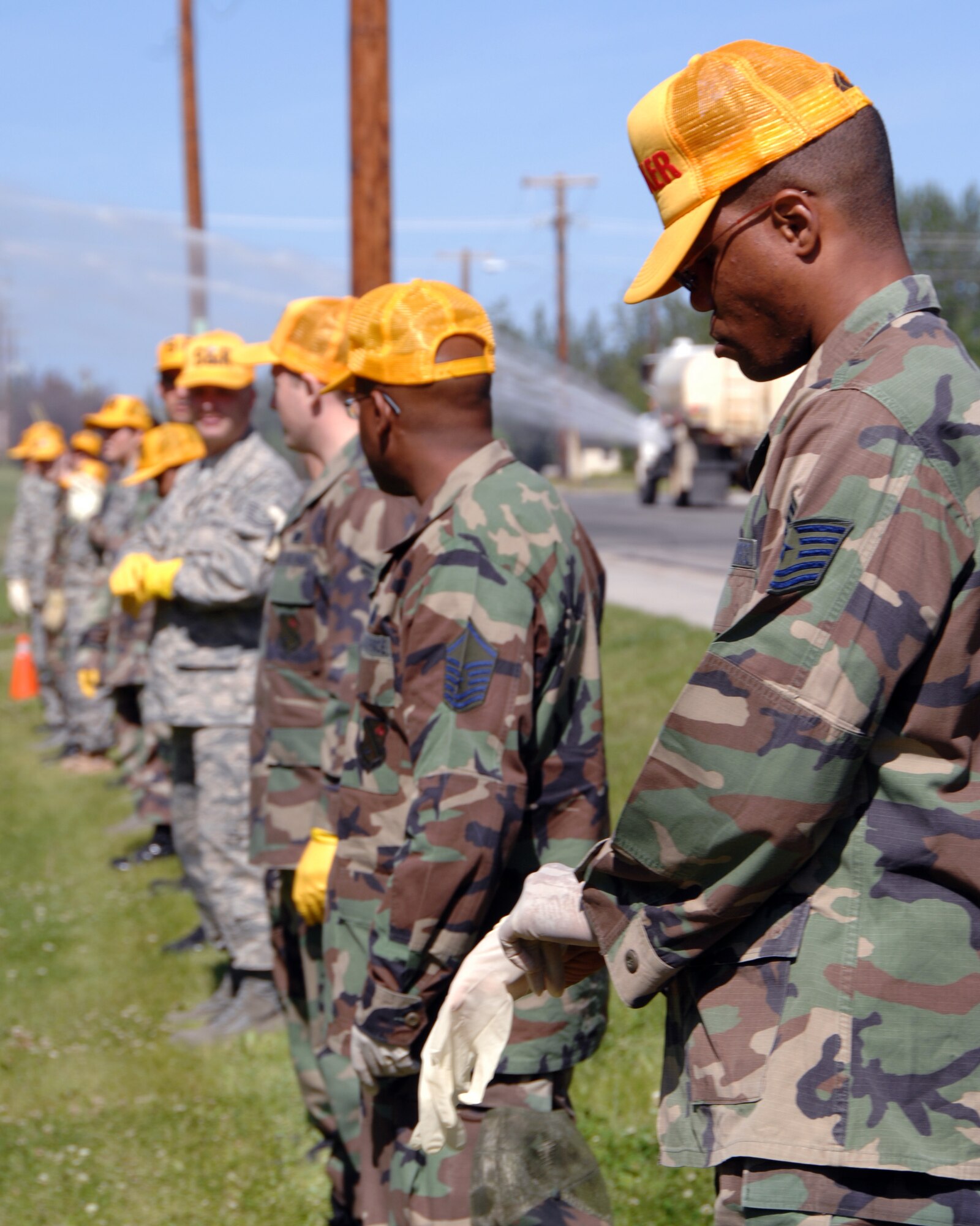 Members of the 354th Force Support Squadron emergency response search and recovery team prepare to conduct a sweep of a simulated aircraft mishap during a search and recovery exercise July 15, 2008. The exercise was designed to provide a realistic aircraft crash training scenario for emergency teams.  (U.S. Air Force photo/Staff Sgt. Tia Schroeder)