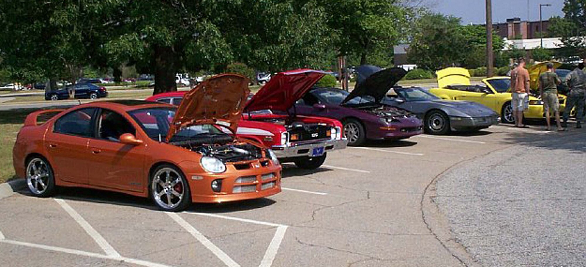 SHAW AIR FORCE BASE, S.C. -- Shaw Airmen check out each other's automobiles during a Shaw Automotive Enthusiasts Club car show June 13. The SAEC is a new organization and is open to all military ID card holders who want to be a part of the club. (Courtesy photo)