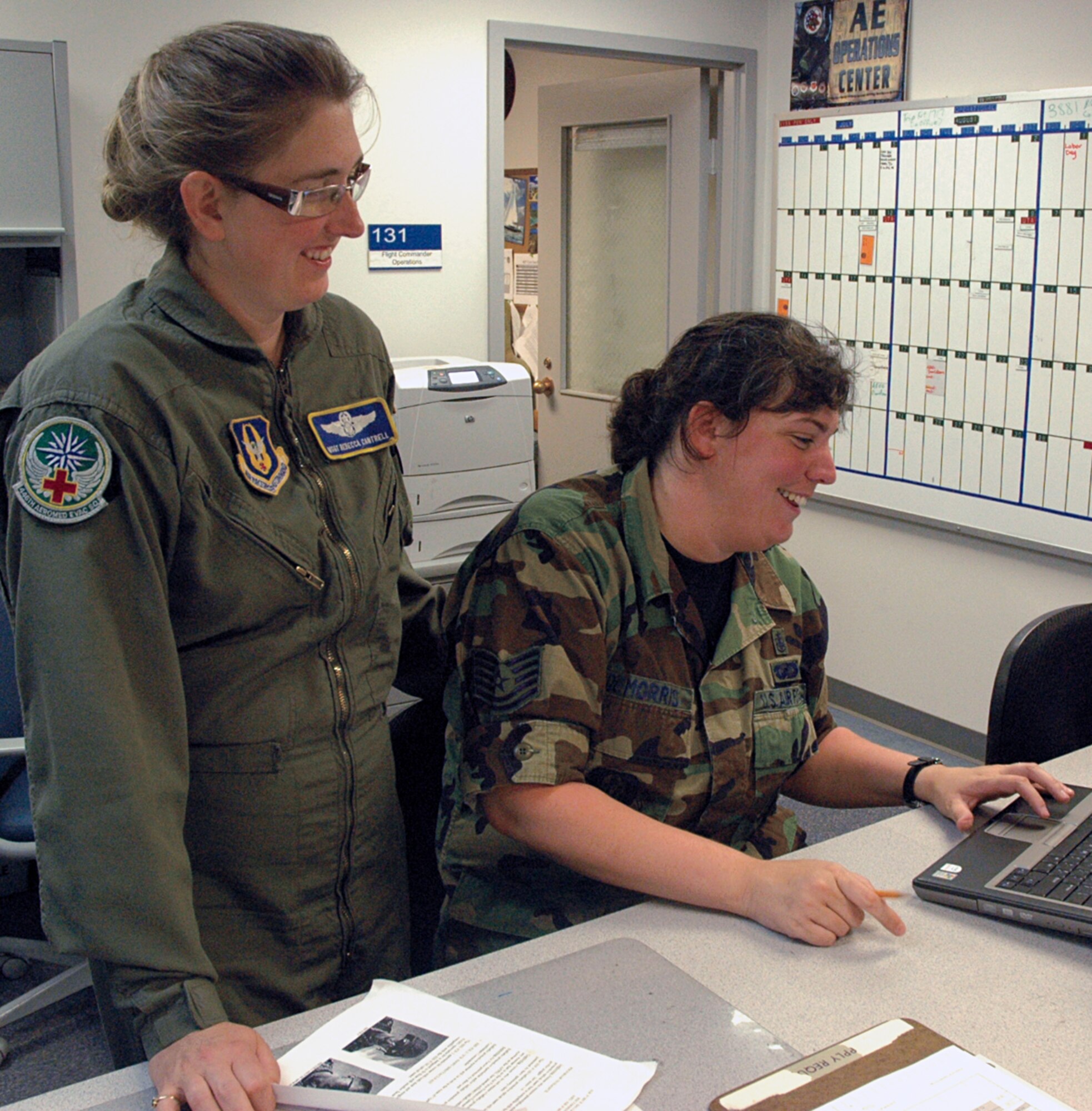 Master Sgt. Rebecca Cantrell (left) of the 446th Aeromedical Evacuation Squadron, shares a laugh with Tech. Sgt. Jennifer DeMorris during the July UTA weekend.  Sergeant Cantrell is set to deploy to Bagram AB, Afghanistan this month in support of Operation Iraqi Freedom, along with 20 other Airmen from the 446th AES.