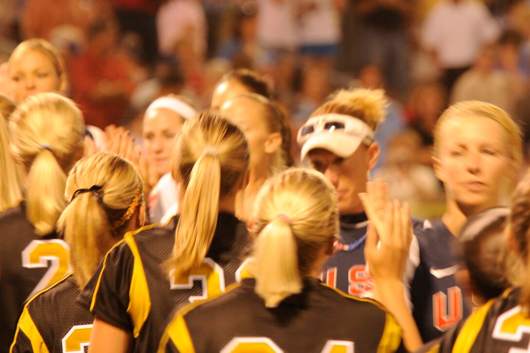 The U.S.A. Olympic Softball and Black Hills Gold softball teams congratulate each other on a game well played at the Pete Lien Memorial Field, Rapid City, S.D., July 15. The Olympic team beat Black Hills Gold 7-0. (U.S. Air Force photo/Senior Airman Kasey Zickmund)