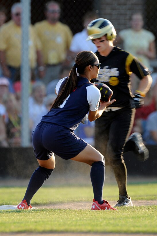 Lovieanne Jung (center), U.S.A Olympic Softball team second baseman, covers first base and gets the out at the Pete Lien Memorial Field, Rapid City, S.D., July 15. Defense was dominating as neither team scored in the first or second inning. (U.S. Air Force photo/Senior Airman Kasey Zickmund)