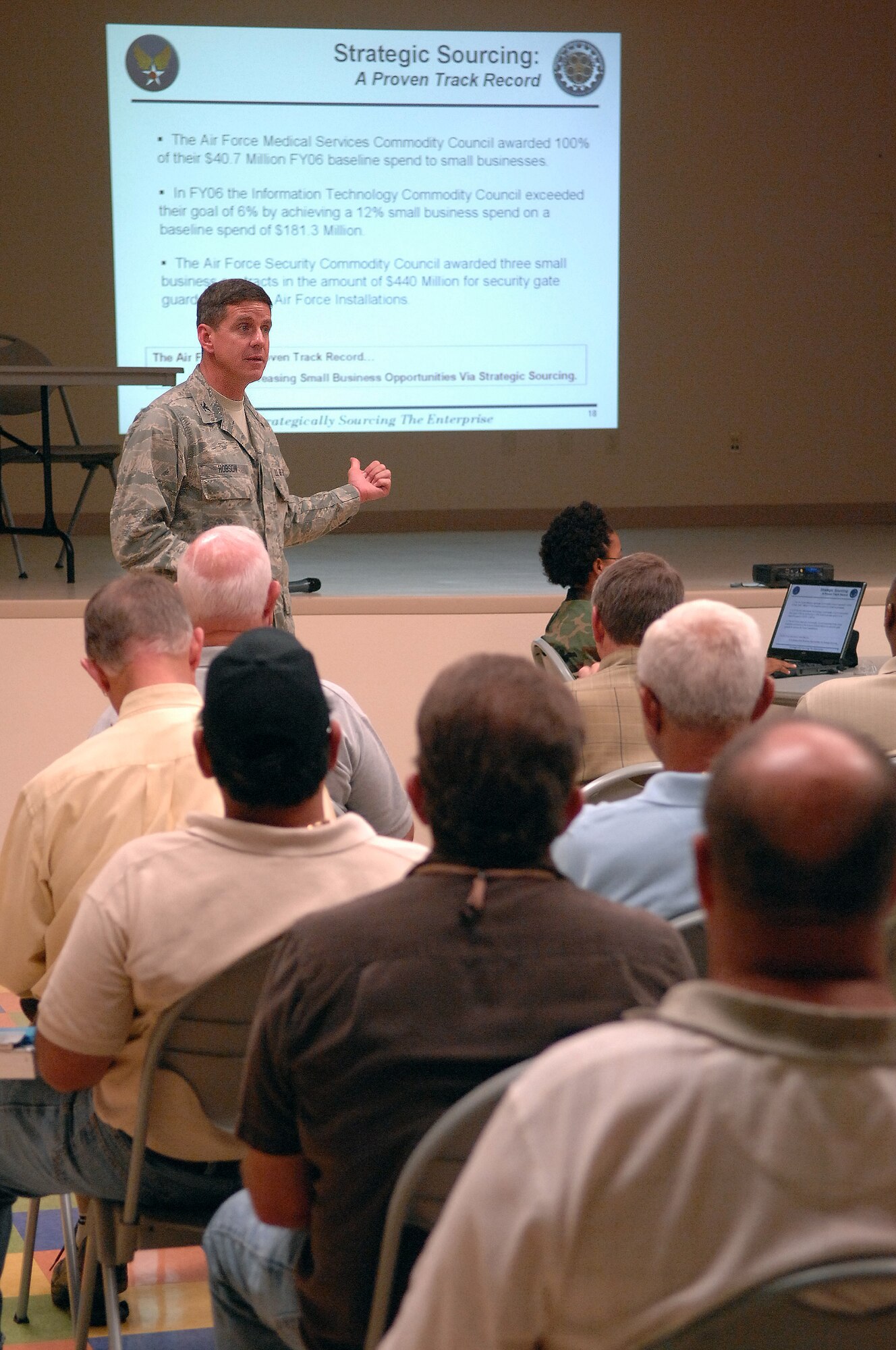 Col. Mark Hobson, Headquarters Air Force Materiel Command Directorate of Contracting Resource Management Division chief, talks to local business owners about how the upcoming Installation Acquisition Transformation will affect how they do business with Nellis Air Force Base during a town hall meeting at the Dr. William C. Pearson Community Center in Las Vegas, Nev., July 14, 2008. Colonel Hobson explained how the transformation would occur and then took questions from the audience regarding their concerns over the changes.  (U.S. Air Force photo / Senior Airman Kasabyan D. Musal)
