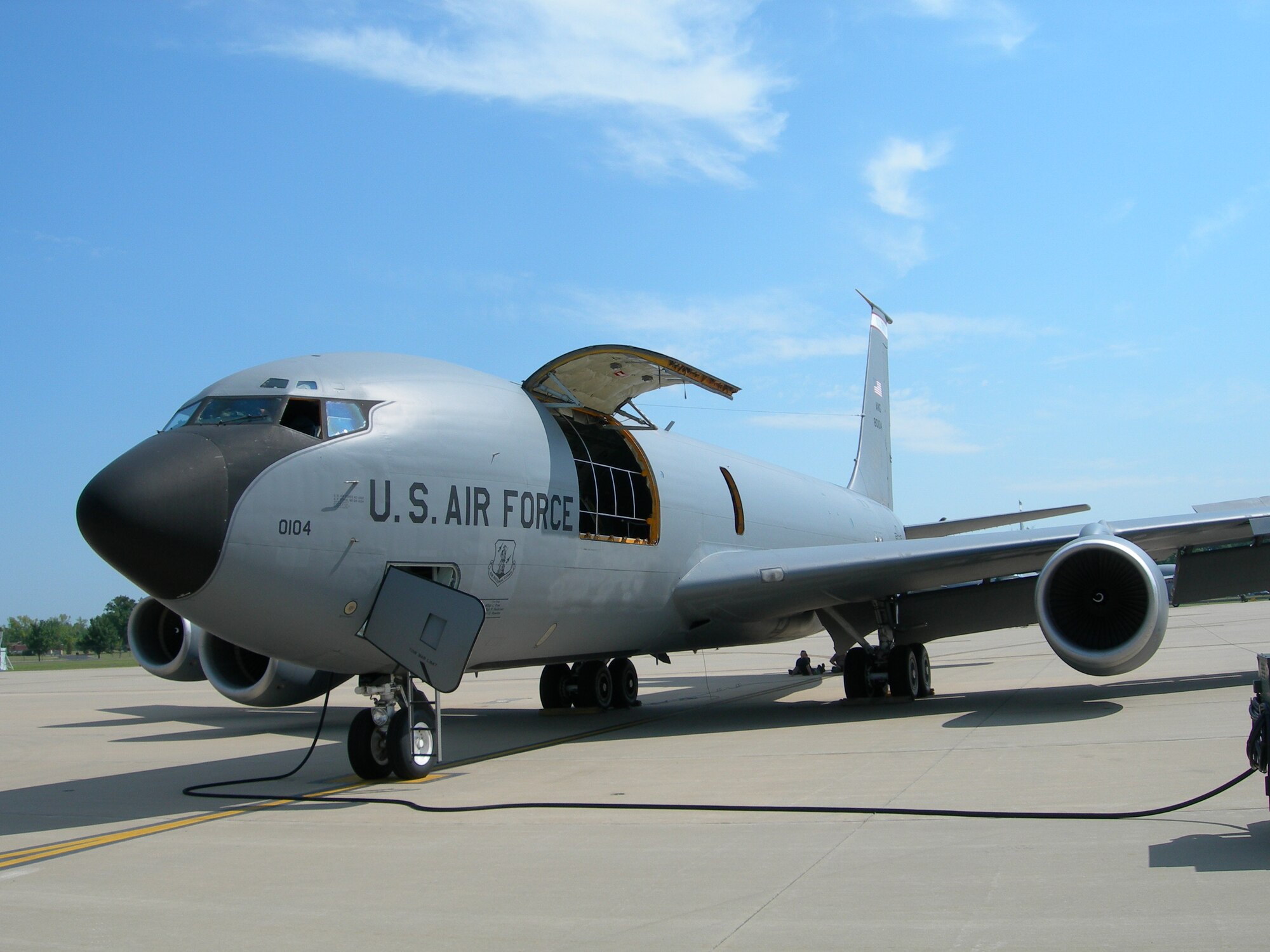 A KC-135 R Model sits on the flightline at Scott Air Force Base while both ground and flight crews perform hours of pre-flight systems checks. 
(Photo/Monte Miller)
