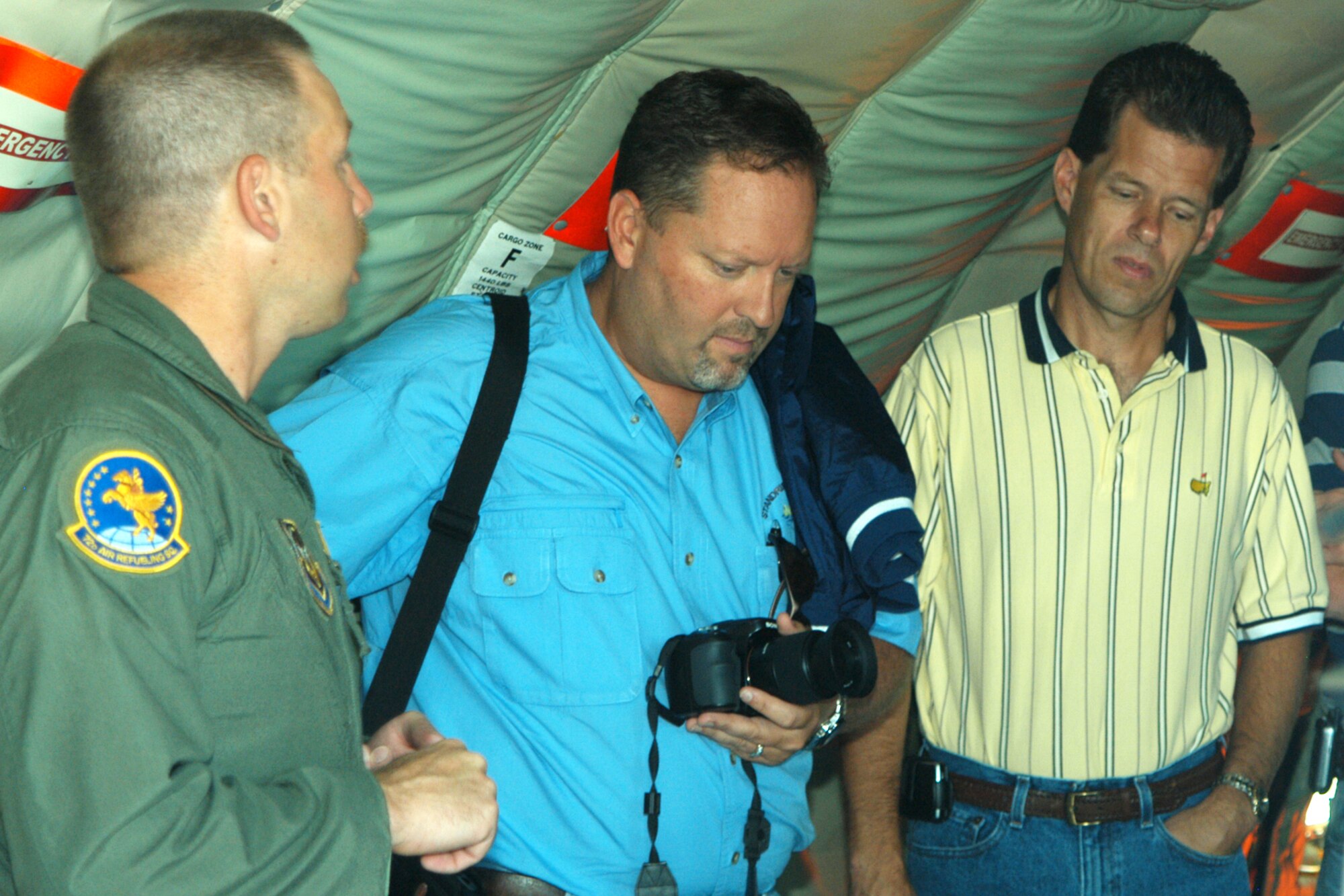 GRISSOM AIR RESERVE BASE, Ind., -- Master Sgt. Paul Sherrod, a boom operator with the 72nd Air Refueling Squadron, talks with civic leaders from the Warsaw, Ind., area prior to departure on a KC-135R Stratotanker refueling mission. The civic leaders met with Brig. Gen. Dean Despinoy, 434th Air Refueling Wing commander, for briefings and had the opportunity to witness an inflight refueling with a C-17 from Charleston AFB, S.C.  Base visits and civic leader flights are part of Grissom's community outreach program.  (U.S. Air Force photo/Capt. Kelly Howard)